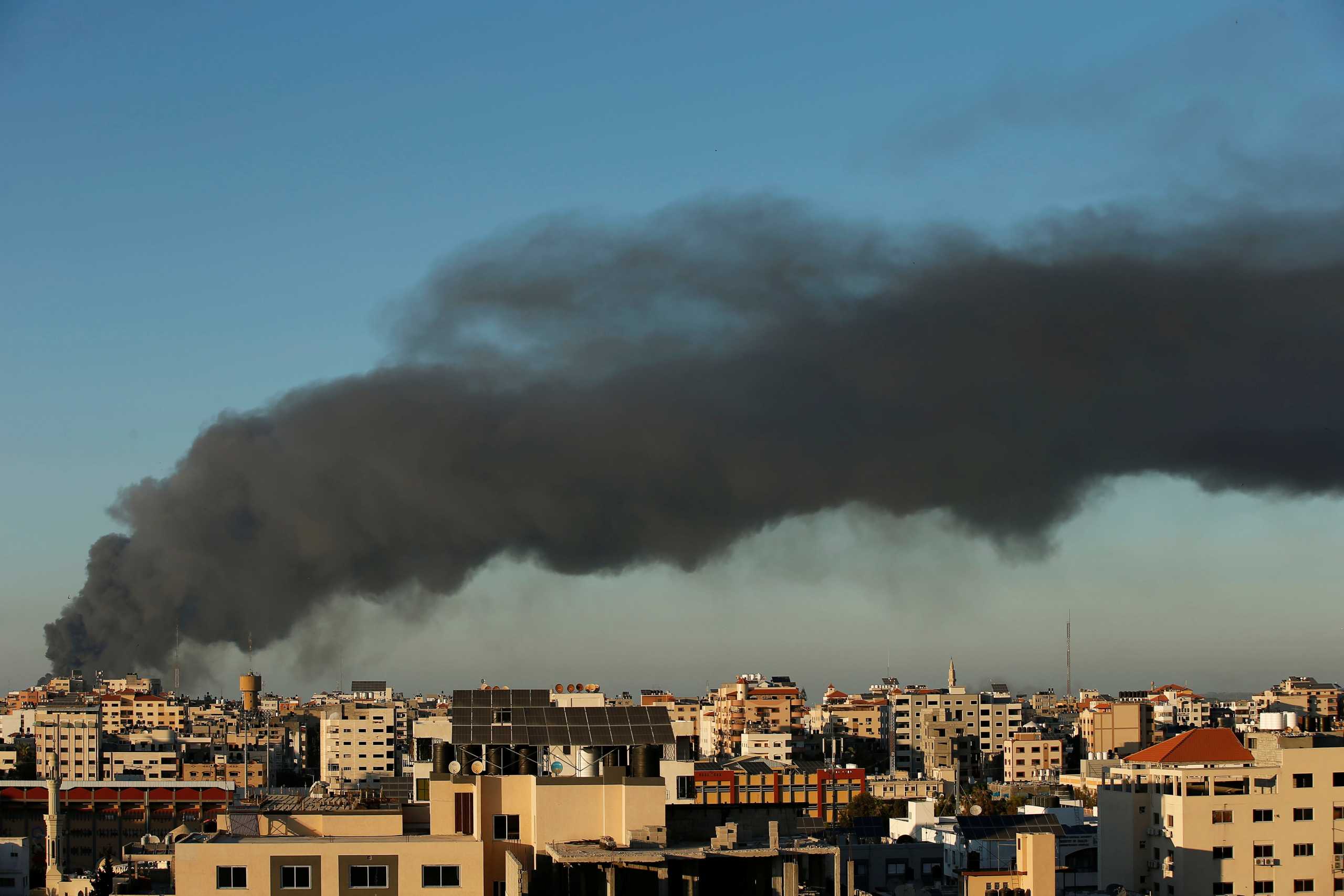 Smoke rises amid a flare-up of Israeli-Palestinian violence, in Gaza May 15, 2021. REUTERS
