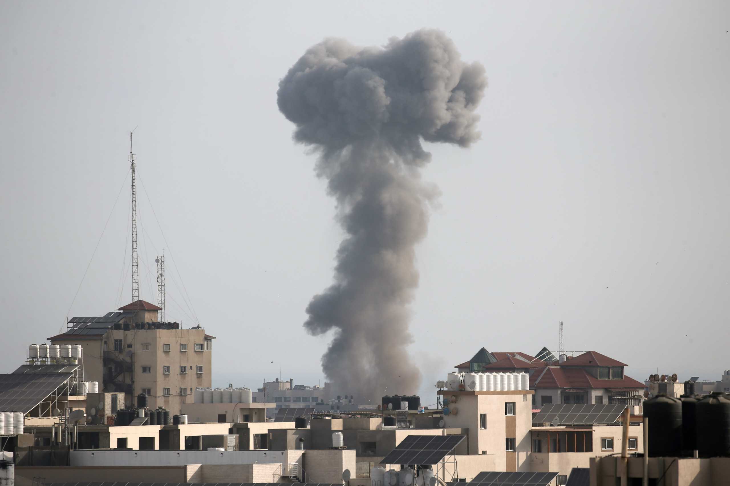 Smoke rises following an Israeli air strike, amid Israeli-Palestinian fighting, in Gaza, May 20, 2021. REUTERS