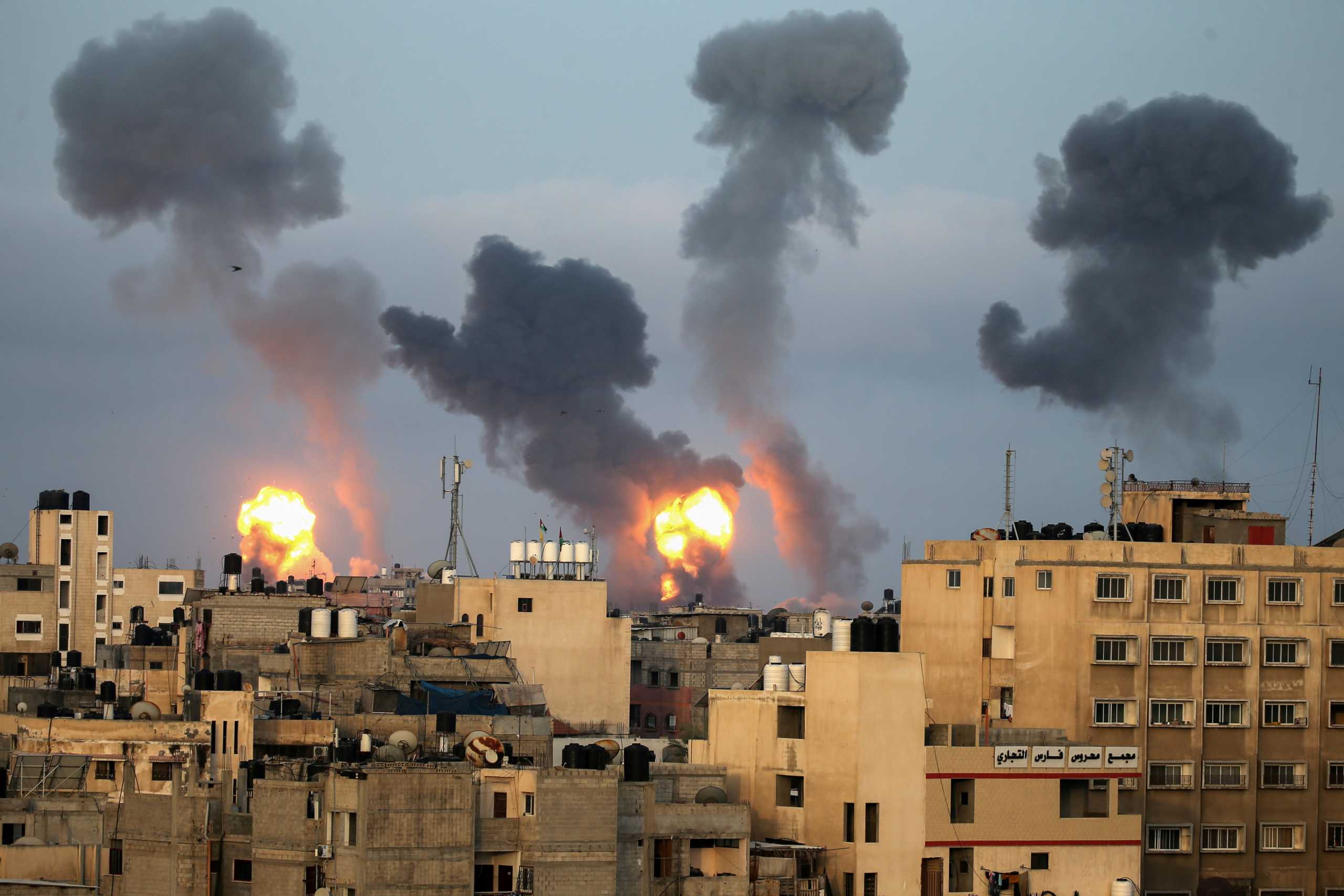 Flames and smoke rise during Israeli air strikes amid a flare-up of Israel-Palestinian violence, in the southern Gaza Strip May 11, 2021. REUTERS