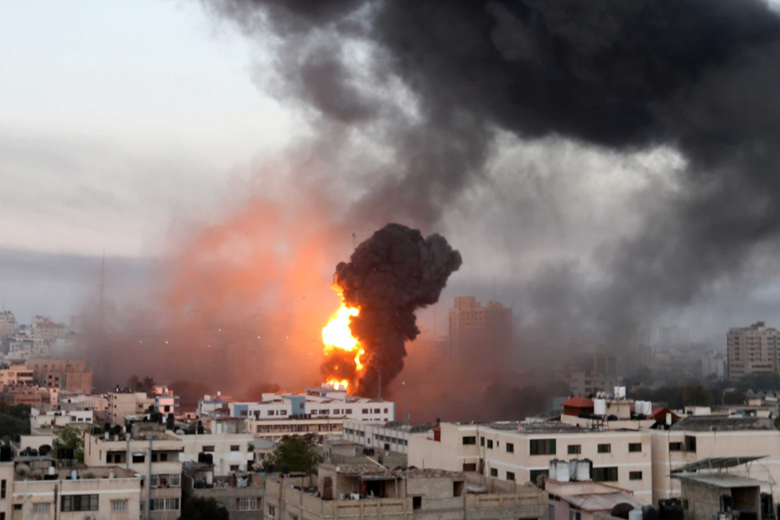 Smoke and flames rise during Israeli air strikes amid a flare-up of Israeli-Palestinian violence, in Gaza May 12, 2021. REUTERS