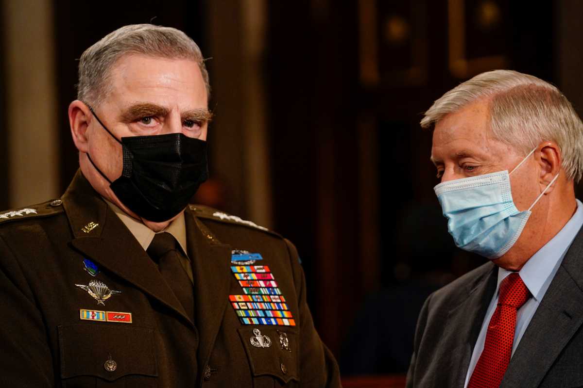 Gen. Mark A. Milley, chairman of the Joint Chiefs of Staff, and Sen. Lindsey O. Graham (R-S.C.) attend as U.S. President Joe Biden addresses a joint session of Congress, with Vice President Kamala Harris and House Speaker Nancy Pelosi (D-Calif.)  in the House chamber of the U.S. Capitol in Washington, U.S., April 28, 2021.  Melina Mara