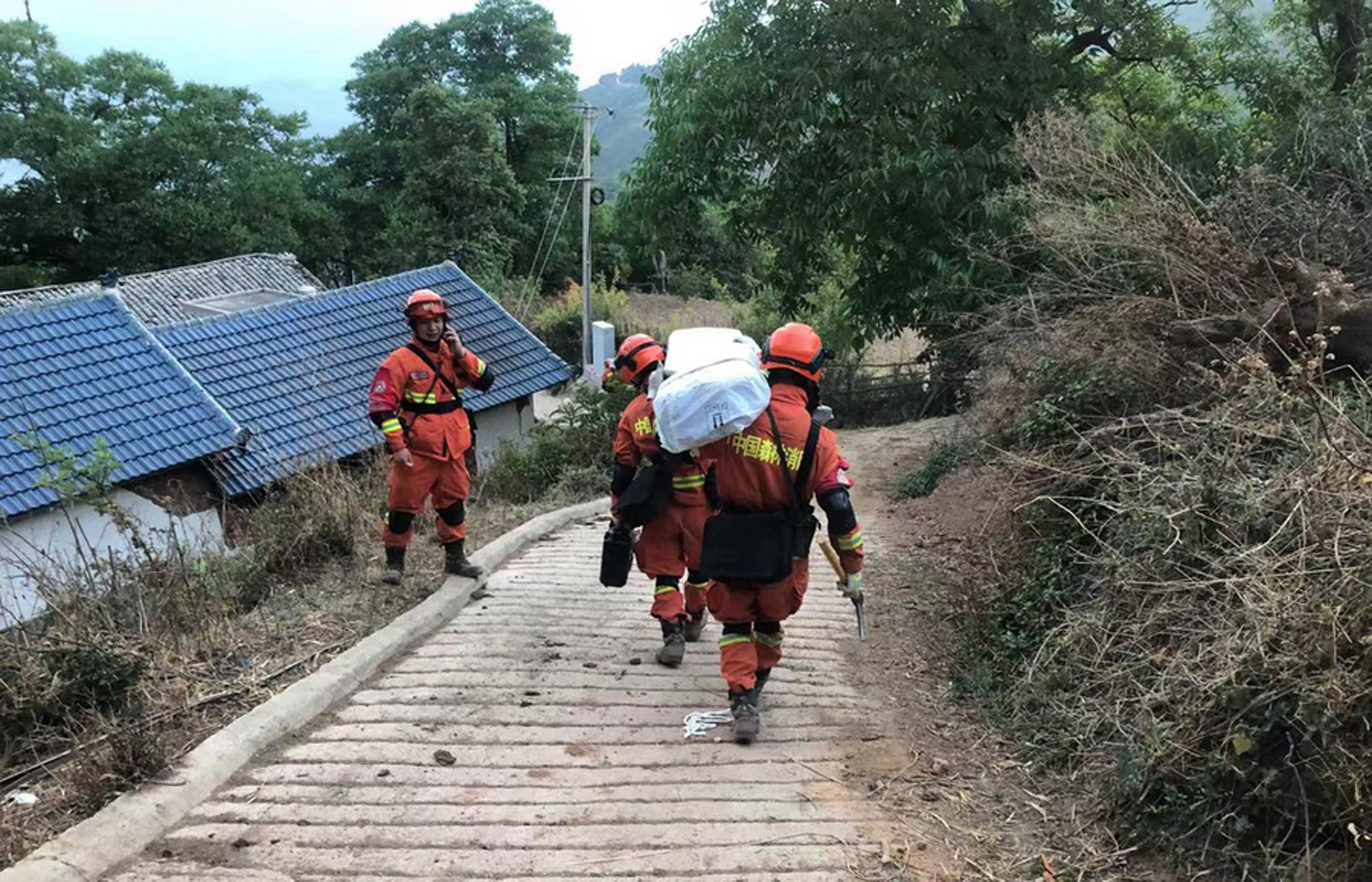 epa09219079 Firemen prepare to set up tents for the homeless hours after a 6.4-magnitude earthquake in Yangbi county, Yunnan province, China, 22 May 2021. The earthquake killed three people and injured 27.  EPA