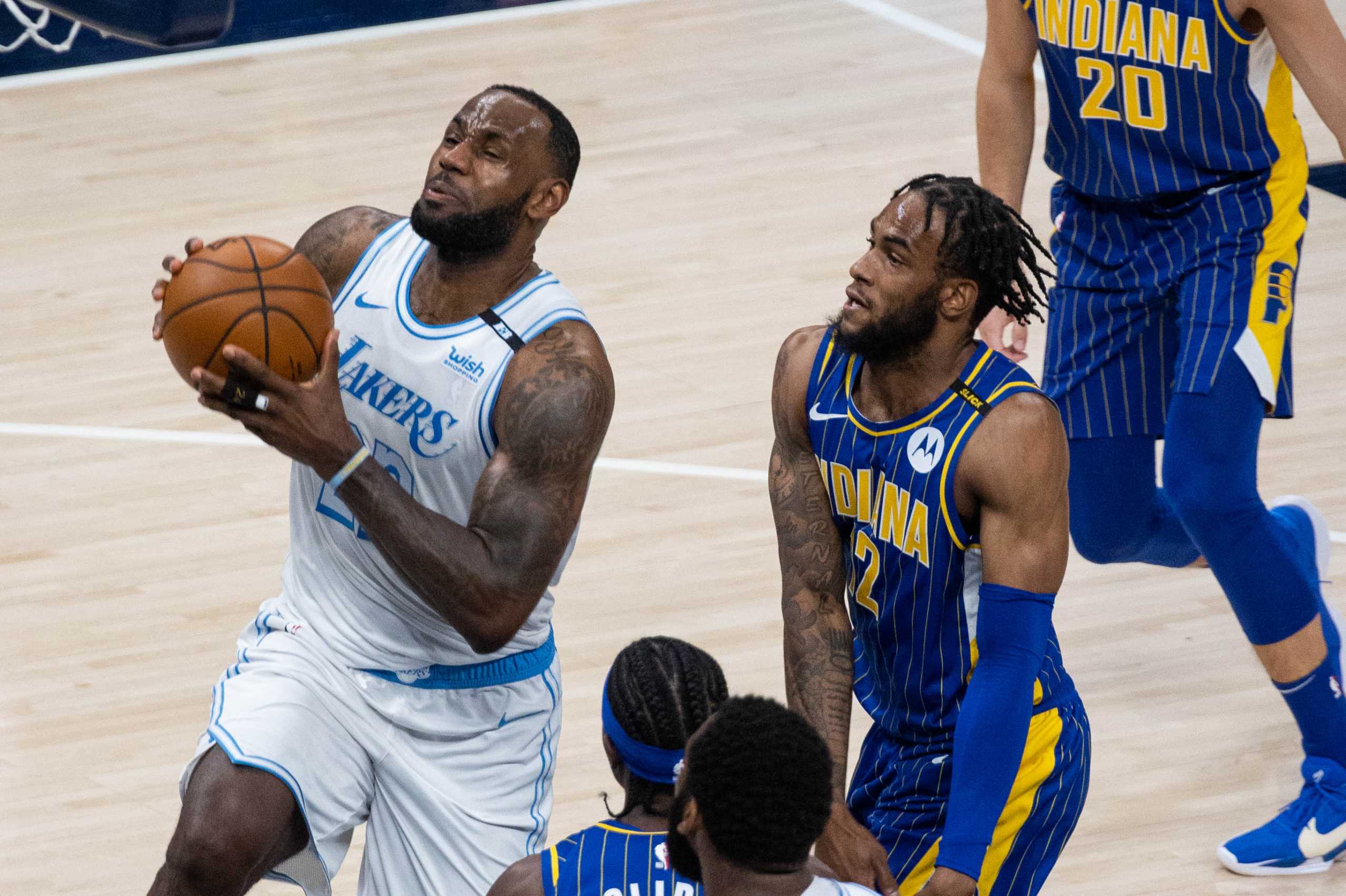 May 15, 2021; Indianapolis, Indiana, USA; Los Angeles Lakers forward LeBron James (23) shoots the ball while Indiana Pacers forward Oshae Brissett (12) defends in the third quarter at Bankers Life Fieldhouse. Mandatory Credit: Trevor Ruszkowski-USA TODAY Sports
