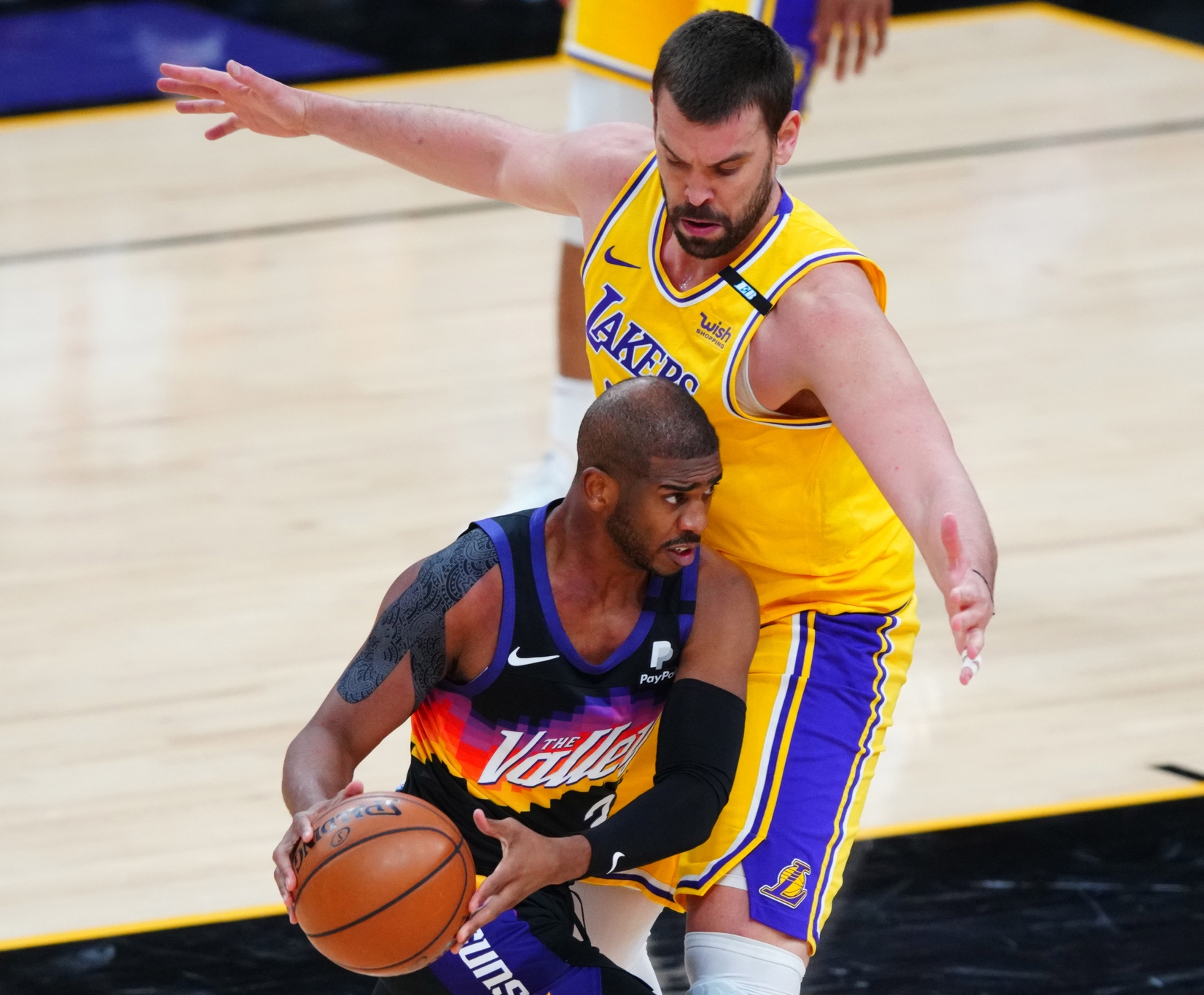 May 25, 2021; Phoenix, Arizona, USA; Phoenix Suns guard Chris Paul (3) controls the ball against Los Angeles Lakers center Marc Gasol during the first half in game two of the first round of the 2021 NBA Playoffs at Phoenix Suns Arena. Mandatory Credit: Mark J. Rebilas-USA TODAY Sports