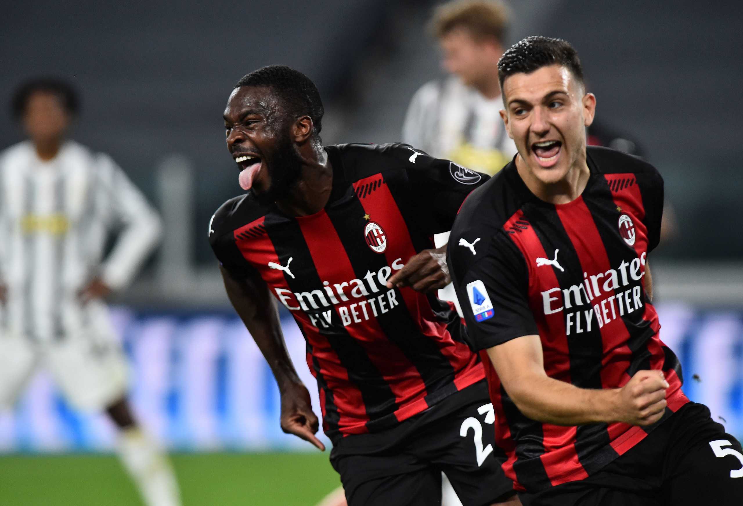 Soccer Football - Serie A - Juventus v AC Milan - Allianz Stadium, Turin, Italy - May 9, 2021 AC Milan's Fikayo Tomori celebrates scoring their third goal with Diogo Dalot REUTERS