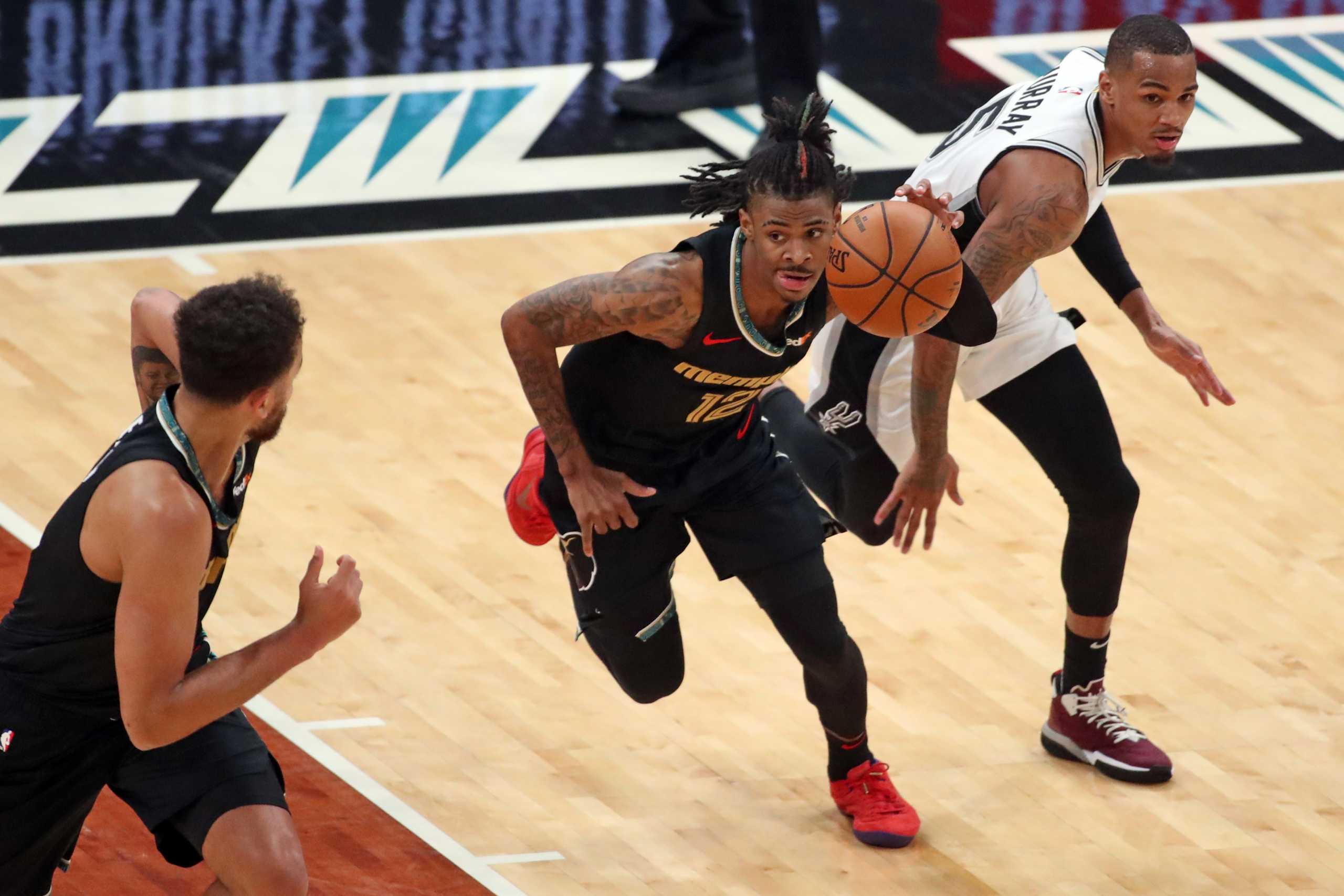 May 19, 2021; Memphis, Tennessee, USA; Memphis Grizzlies guard Ja Morant (12) dribbles up court during the third quarter against the San Antonio Spurs at FedExForum. Mandatory Credit: Petre Thomas-USA TODAY Sports