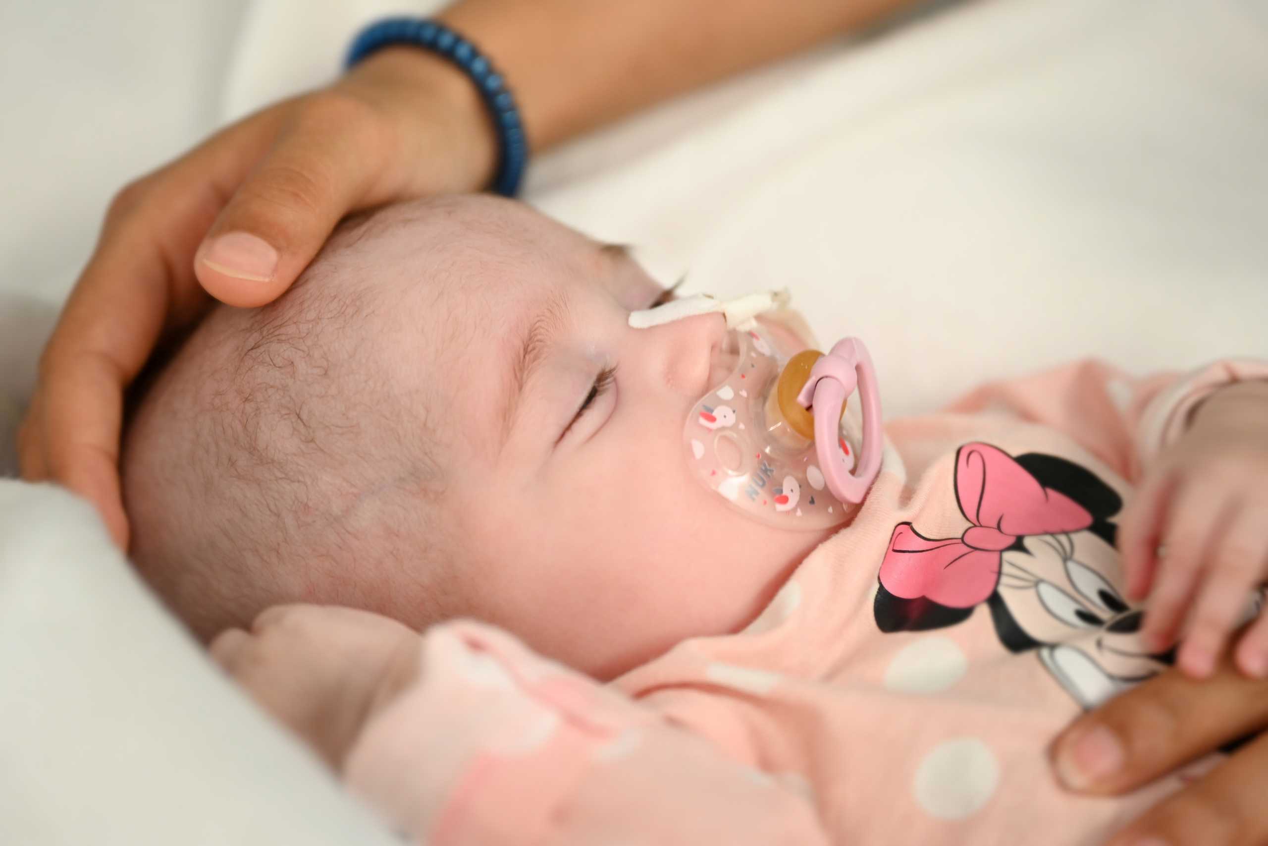 Two-month old Spanish baby girl Naiara, who received a heart transplant in a pioneering surgery where doctors used a heart that had already stopped beating from a donor with a different blood type, is seen in this handout picture released May 17, 2021 by Gregorio Maranon Hospital in Madrid, Spain. Gregorio Maranon Hospital