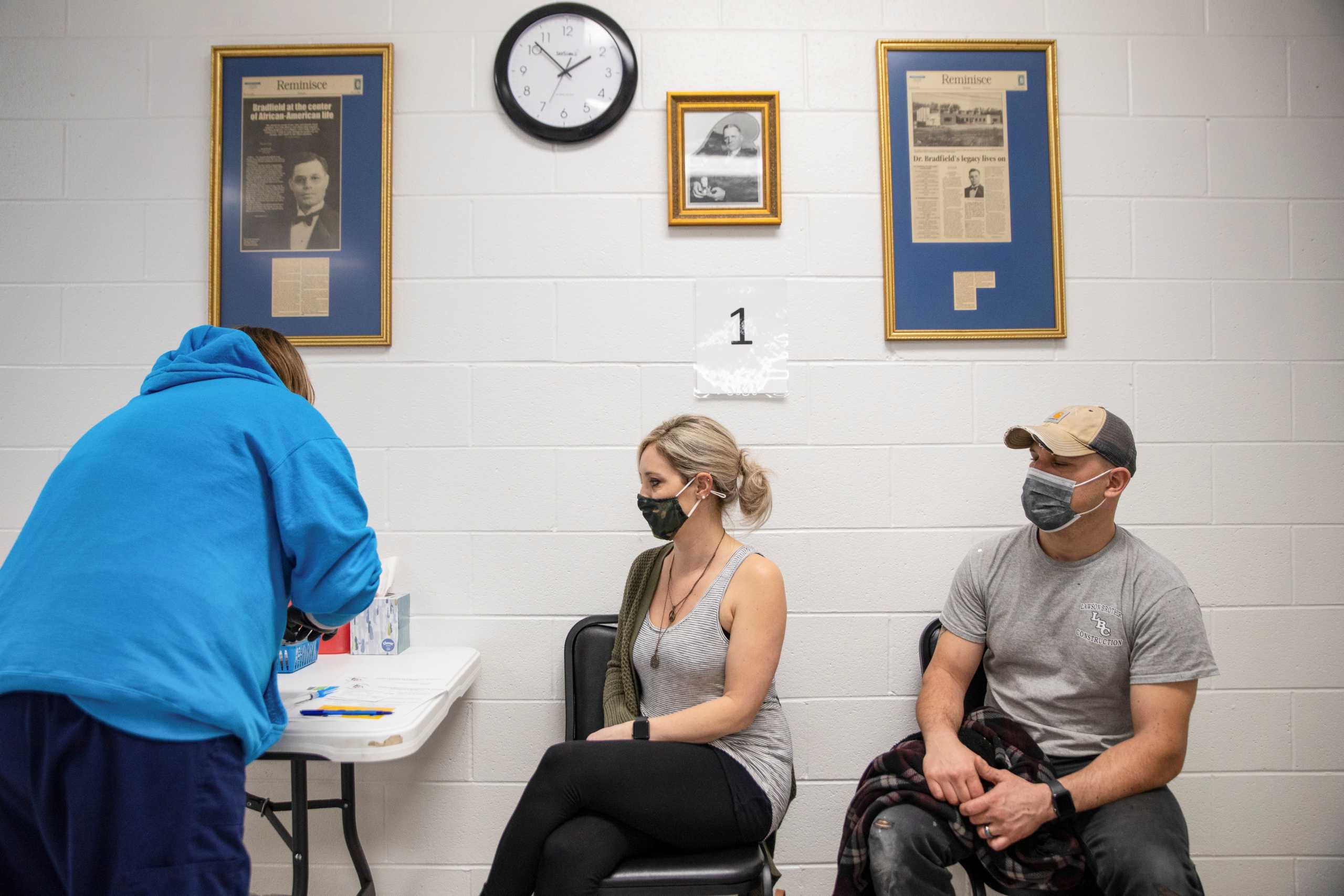 FILE PHOTO: Stefanie Dunahay, 39, and Matt Dunahay, 39, wait to receive their coronavirus disease (COVID-19) vaccine as vaccine eligibility expands to anyone over the age of 16 at the Bradfield Community Center through Health Partners of Western Ohio in Lima, Ohio, U.S., March 29, 2021.  REUTERS