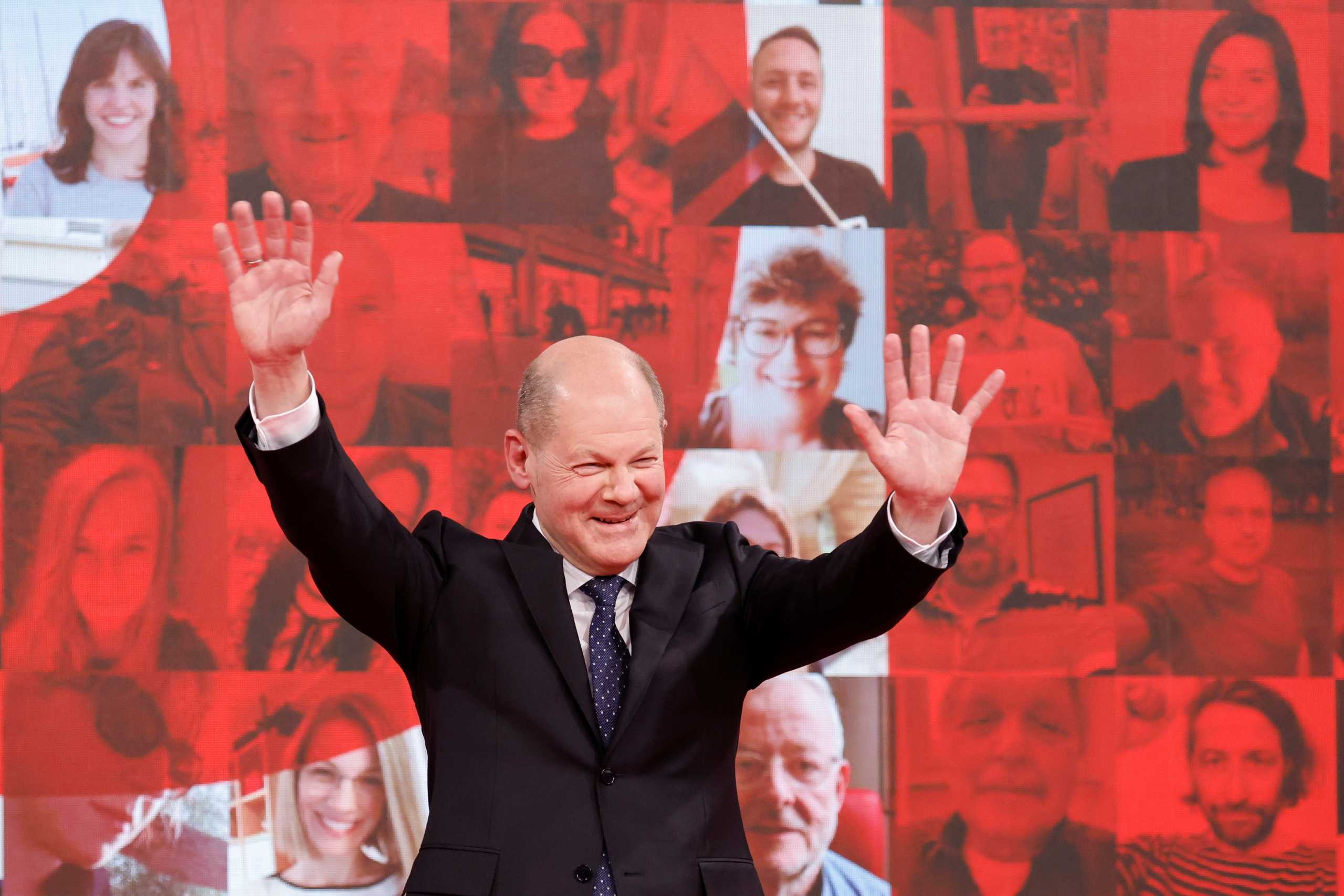 German Social Democratic Party (SPD) candidate for chancellor Olaf Scholz cheers on stage during a party meeting in Berlin, Germany, May 9, 2021. REUTERS