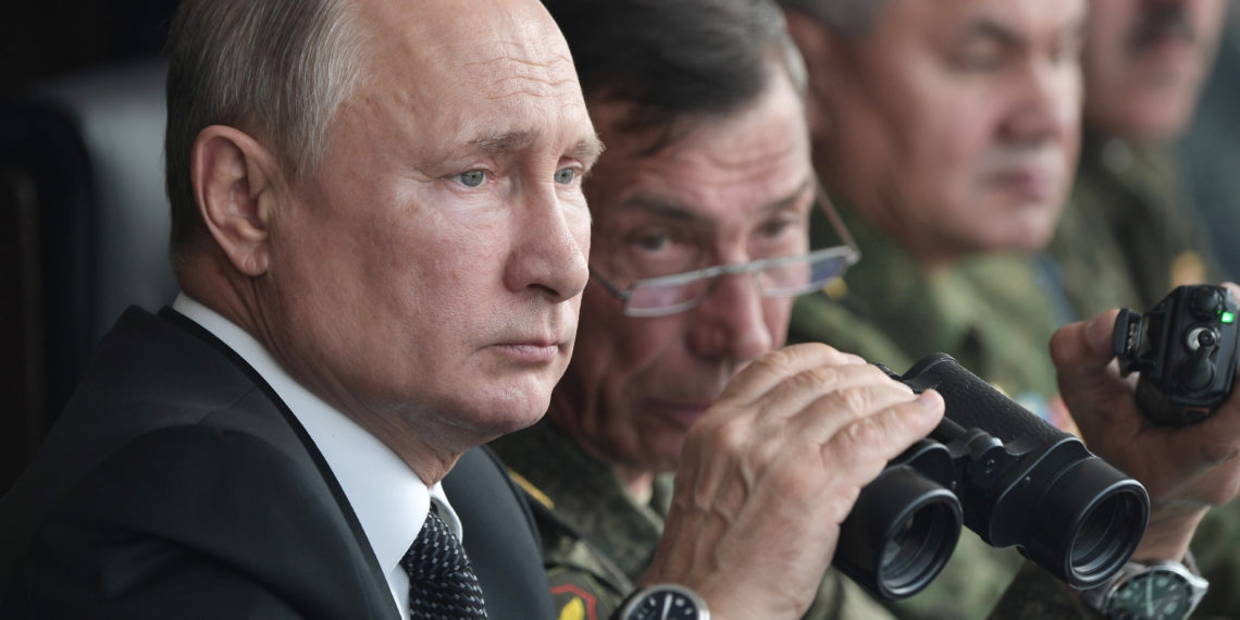 Russia's President Vladimir Putin uses a pair of binoculars while overseeing the military exercises known as "Centre-2019" at the firing range Donguz in Orenburg Region, Russia September 20, 2019. Sputnik