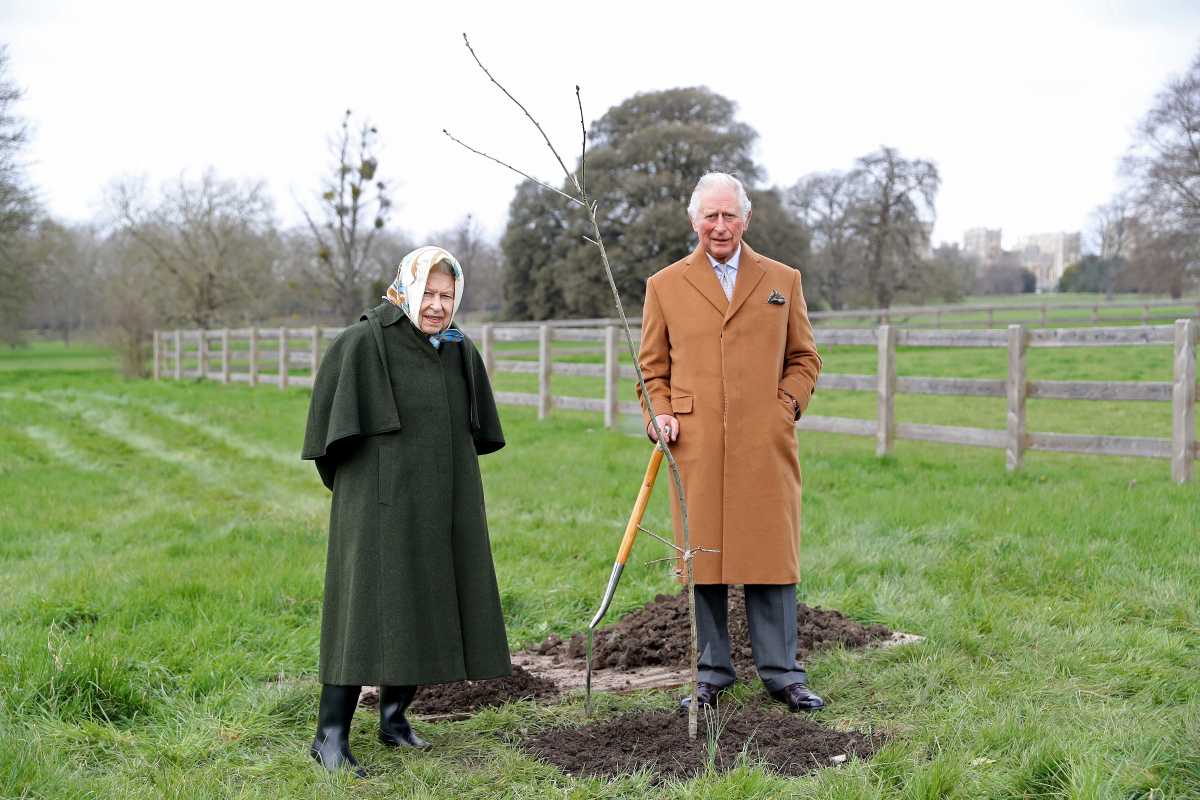 Britain's Queen Elizabeth and Prince Charles stand next to the first Jubilee tree on the grounds of Windsor Castle, Britain March 23, 2021. Picture taken March 23, 2021. The tree was planted by the Prince of Wales to launch the Queen's Green Canopy, a UK-wide tree planting initiative created to mark her Platinum Jubilee in 2022, of which the prince is patron. Chris Jackson