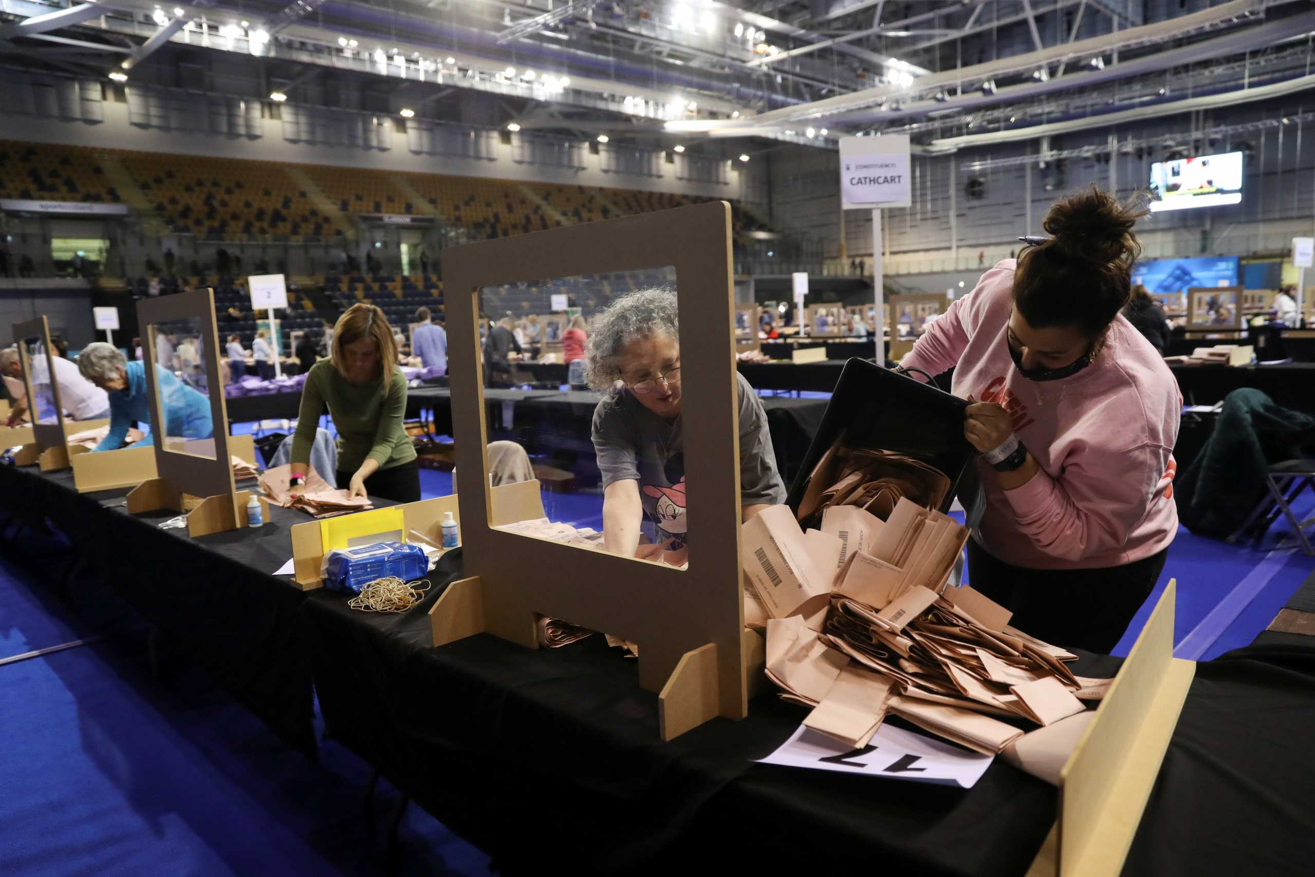Election staff members count votes for the Scottish Parliamentary election at a counting centre in Glasgow, Scotland, Britain, May 8, 2021. REUTERS