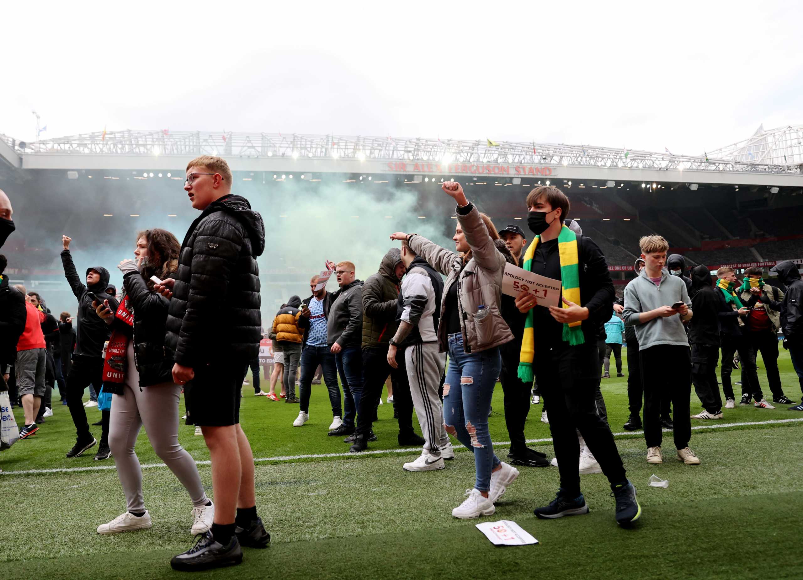 Soccer Football - Manchester United fans protest against their owners before the Manchester United v Liverpool Premier League match - Old Trafford, Manchester, Britain - May 2, 2021 Manchester United fans on the pitch in protest against their owners before the match Action Images via REUTERS