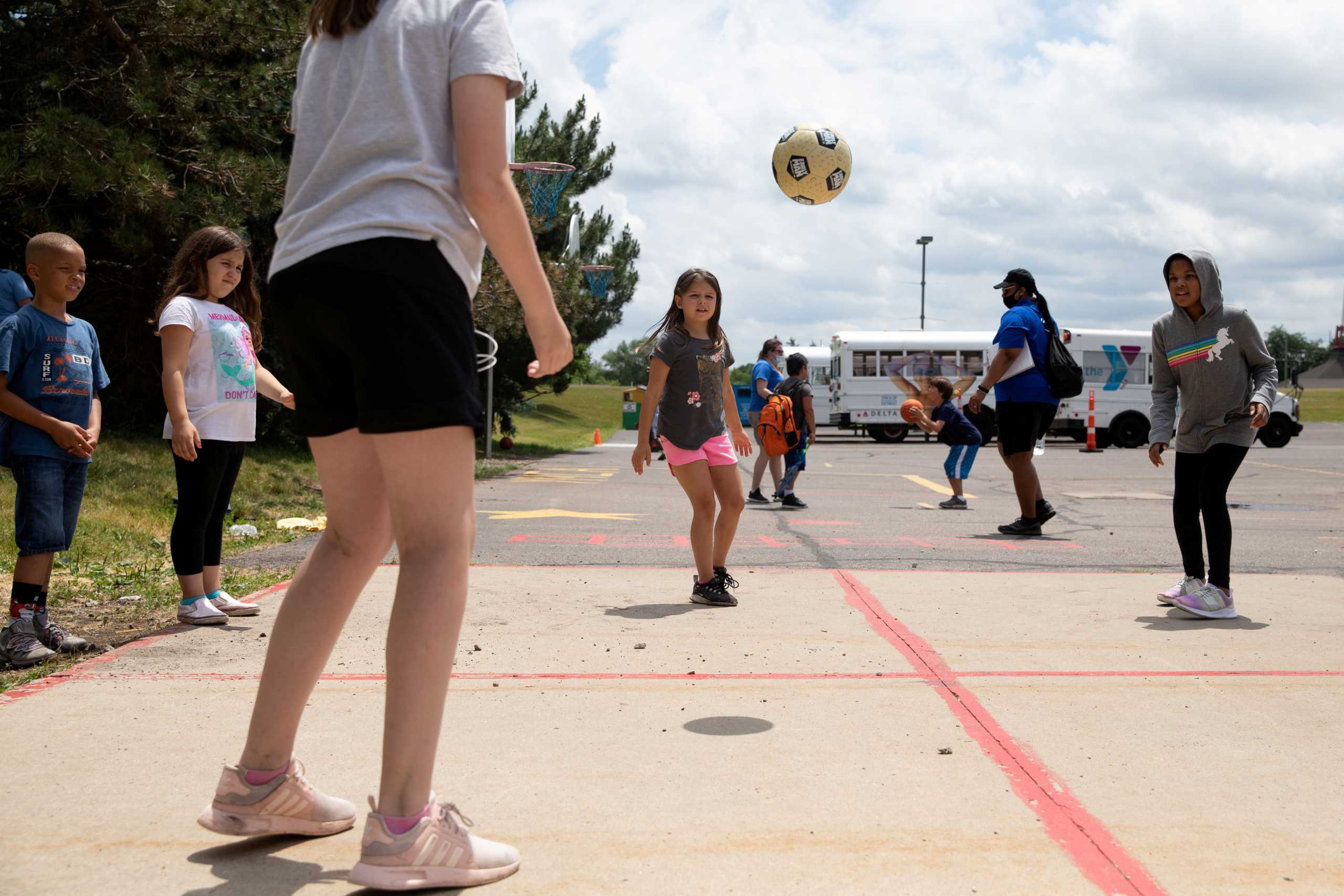 FILE PHOTO: Children play outside at Farmington Family YMCA summer camp, amid the coronavirus disease (COVID-19) outbreak, in Farmington Hills, Michigan, U.S., June 23, 2020.  REUTERS