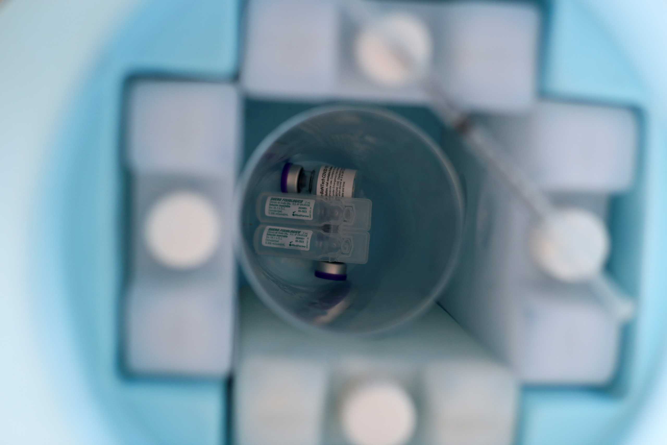 Vials with the Pfizer-BioNTech vaccine against the coronavirus disease (COVID-19), are seen at a vaccination centre in the Santa Maria de Ojial community, in Iquitos, Peru May 15, 2021. Picture taken May 15, 2021.  REUTERS