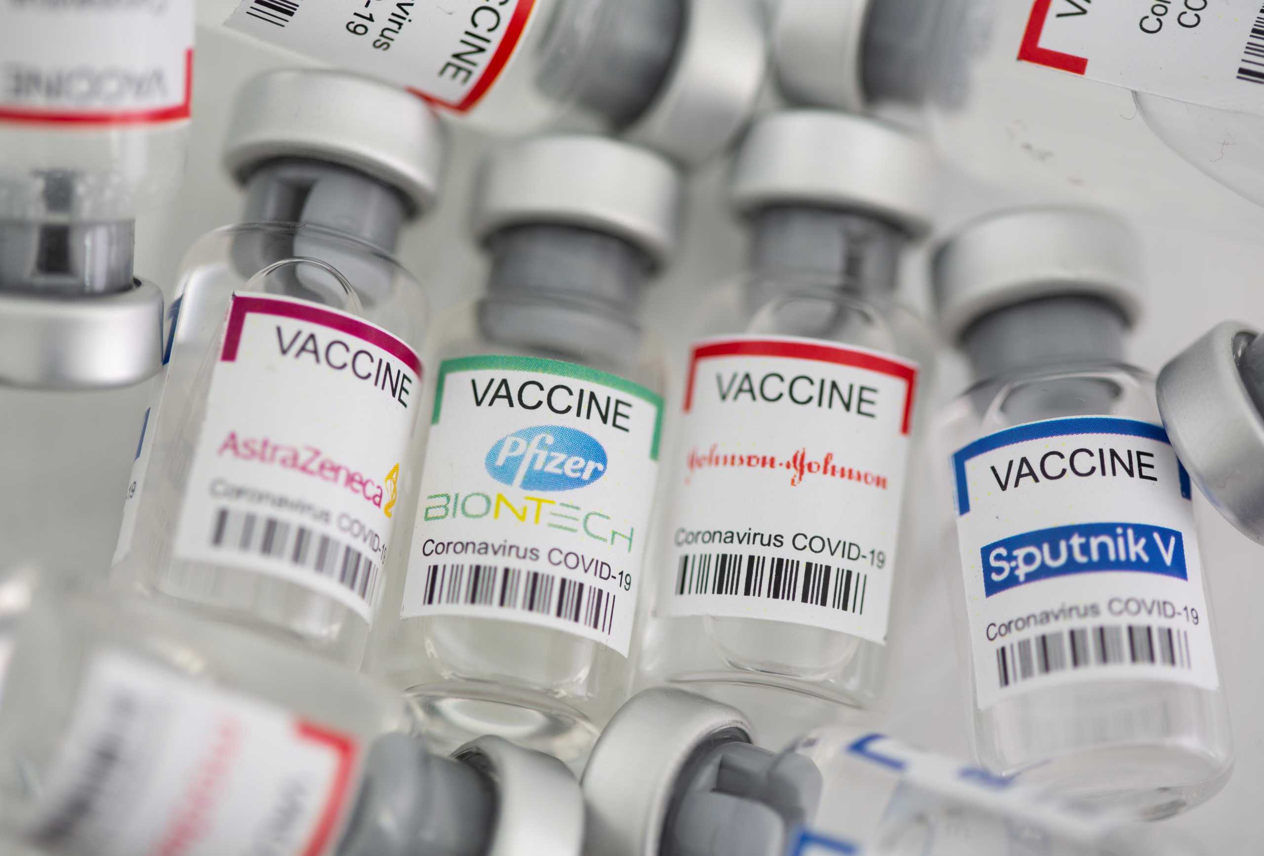 Vials labelled "AstraZeneca, Pfizer - Biontech, Johnson&Johnson, Sputnik V coronavirus disease (COVID-19) vaccine" are seen in this illustration picture taken May 2, 2021. REUTERS