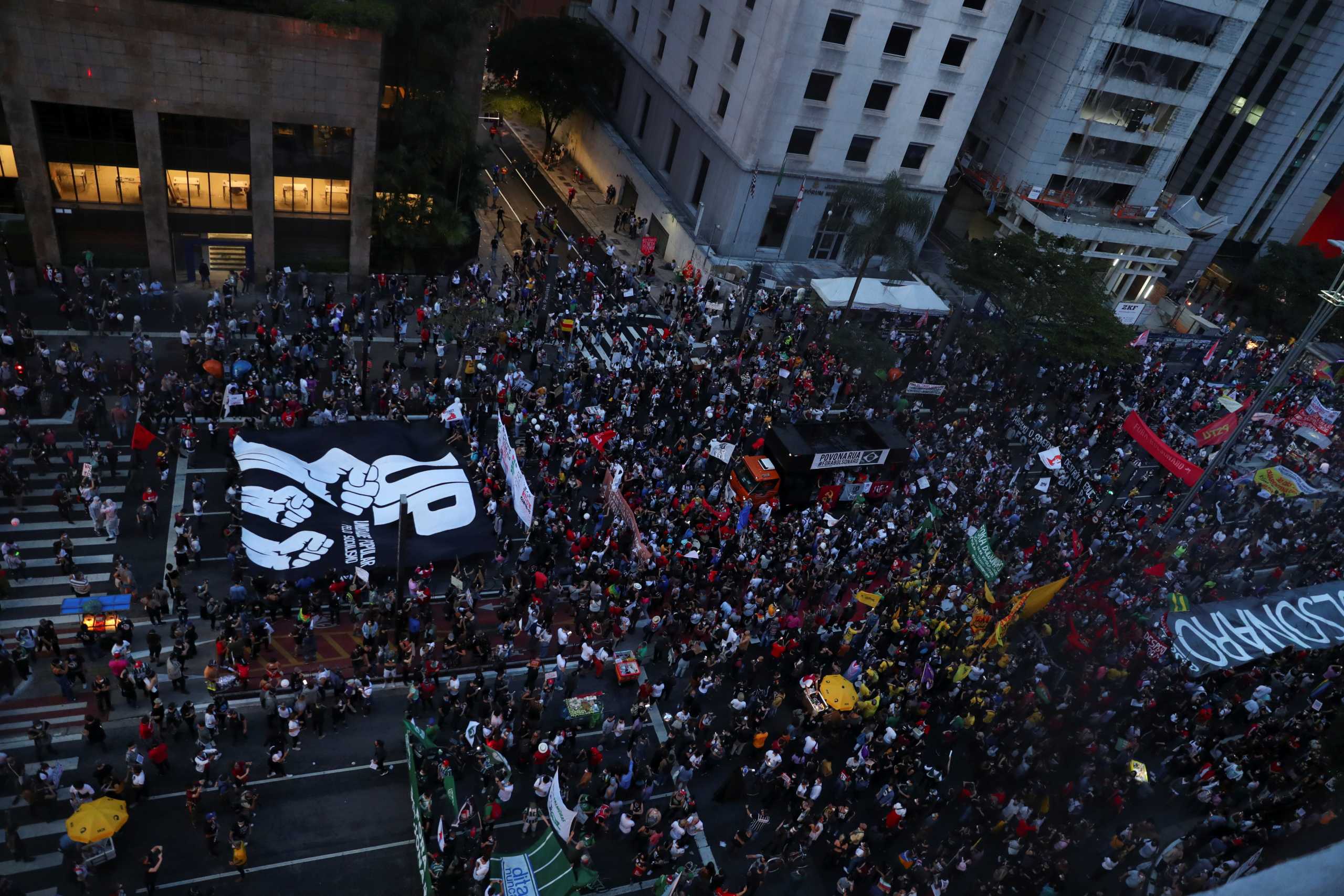 People attend a protest against Brazil's President Jair Bolsonaro, in Sao Paulo, Brazil, May 29, 2021. REUTERS