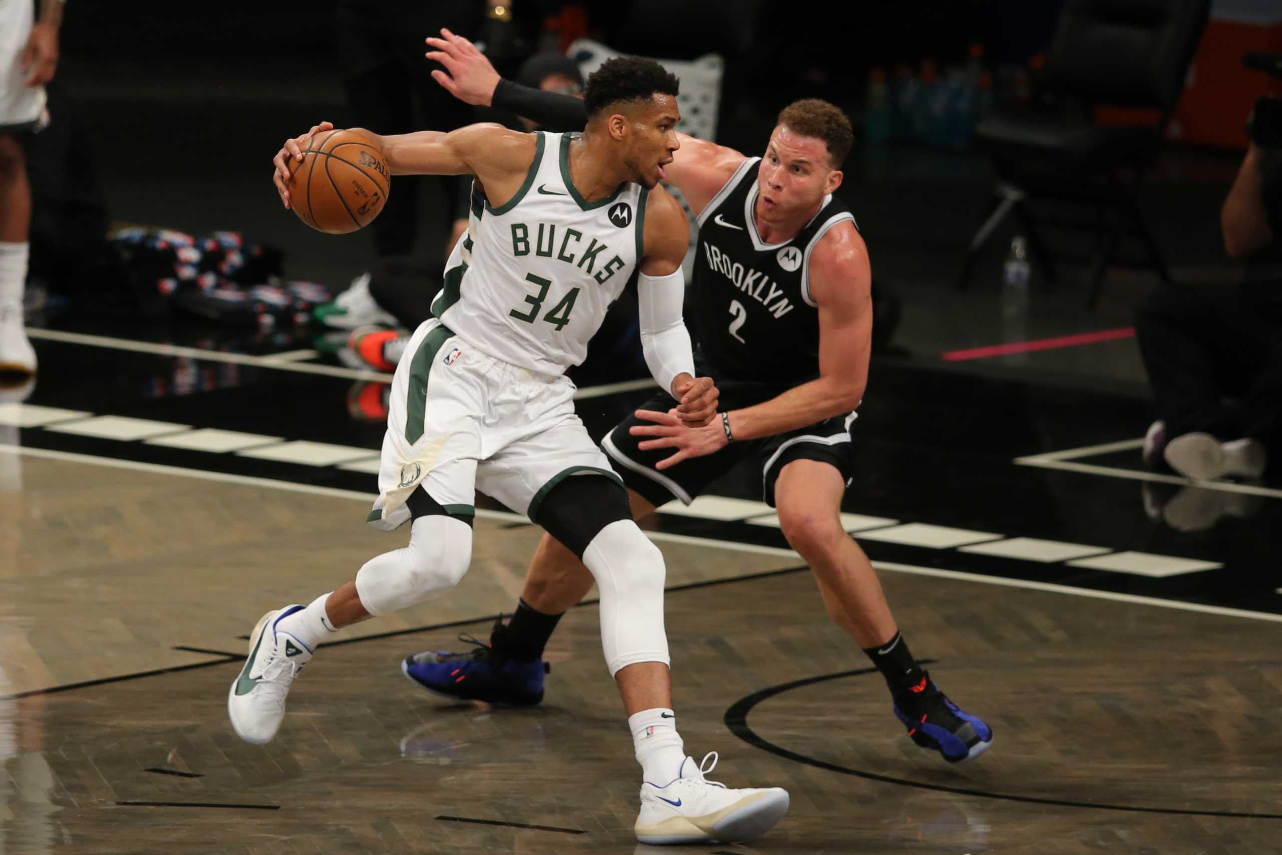 Jun 5, 2021; Brooklyn, New York, USA; Milwaukee Bucks power forward Giannis Antetokounmpo (34) controls the ball against Brooklyn Nets power forward Blake Griffin (2) during the third quarter of game one in the Eastern Conference semifinals of the 2021 NBA Playoffs at Barclays Center. Mandatory Credit: Brad Penner-USA TODAY Sports