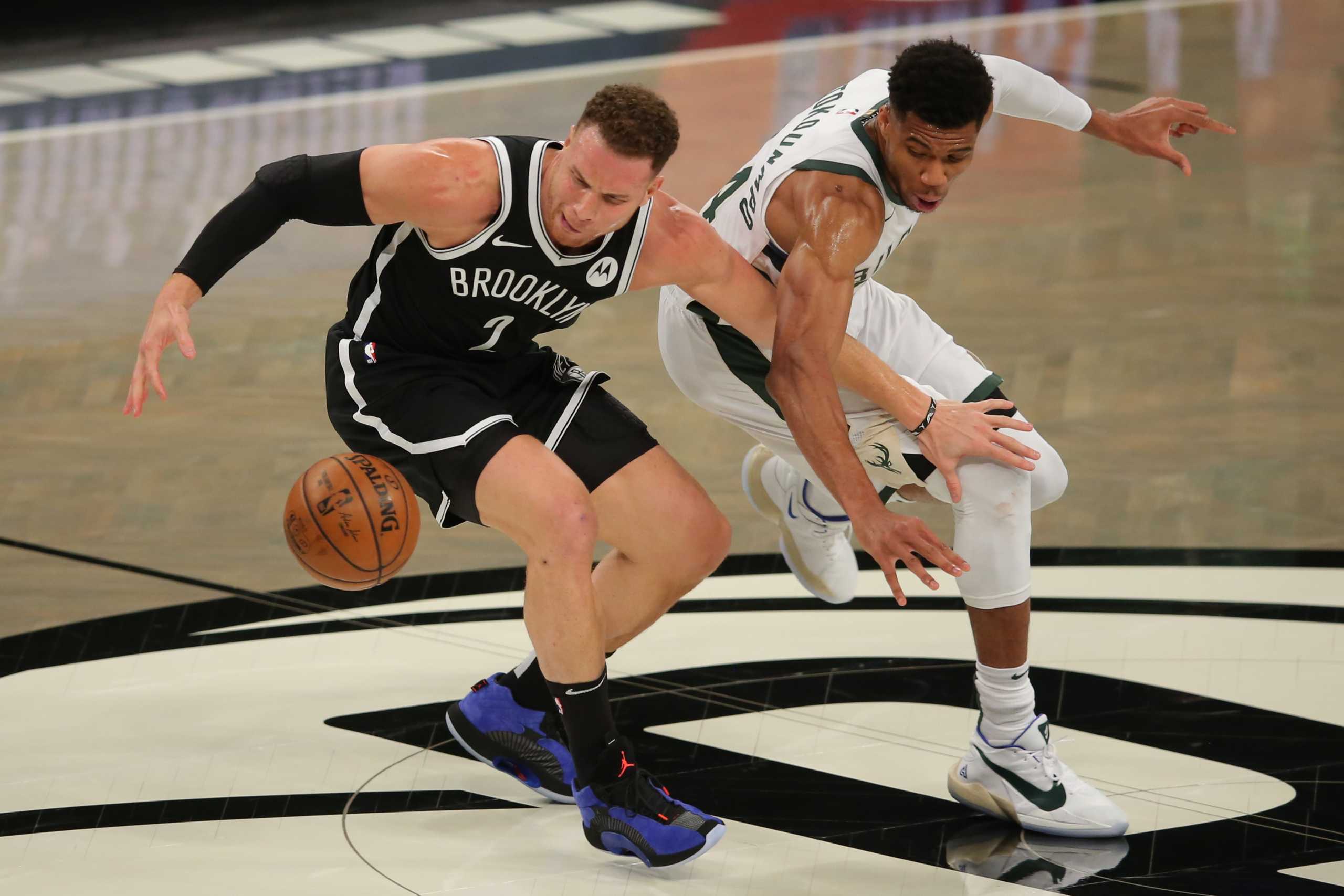 Jun 5, 2021; Brooklyn, New York, USA; Brooklyn Nets power forward Blake Griffin (2) and Milwaukee Bucks power forward Giannis Antetokounmpo (34) fight for a loose ball during the first quarter of game one in the Eastern Conference semifinals of the 2021 NBA Playoffs at Barclays Center. Mandatory Credit: Brad Penner-USA TODAY Sports