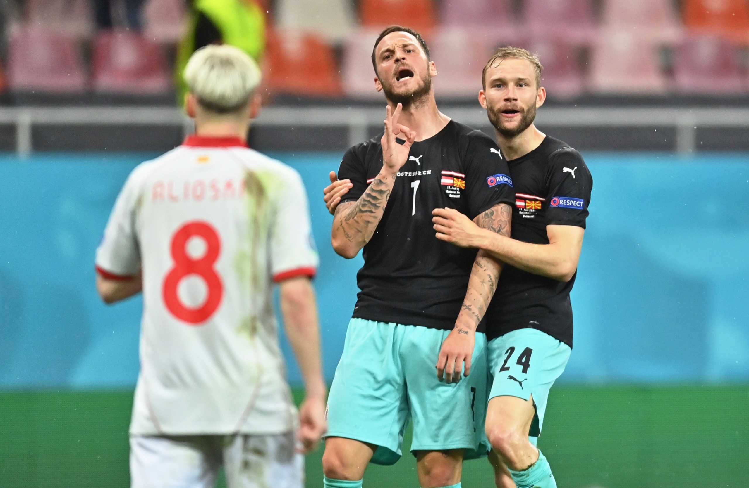 Soccer Football - Euro 2020 - Group C - Austria v North Macedonia - National Arena, Bucharest, Romania - June 13, 2021 Austria's Marko Arnautovic celebrates scoring their third goal with Konrad Laimer Pool via REUTERS