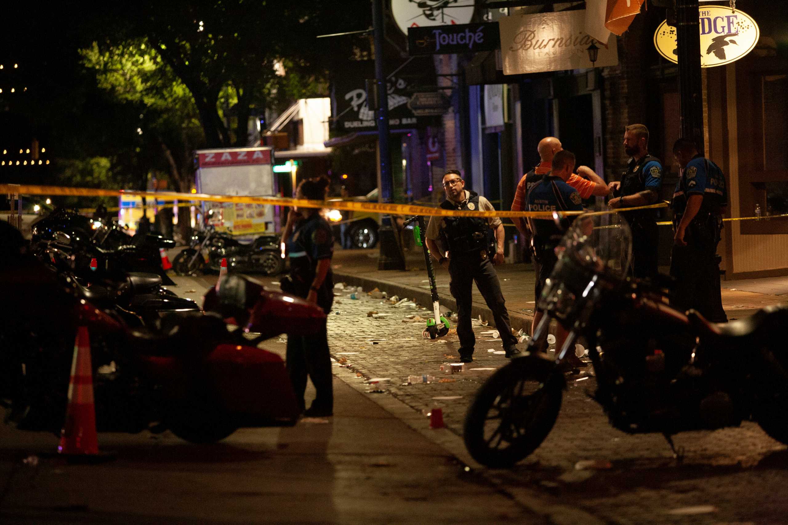 Police investigate the scene of a mass shooting in the Sixth Street entertainment district area of Austin, Texas, U.S. June 12, 2021. REUTERS