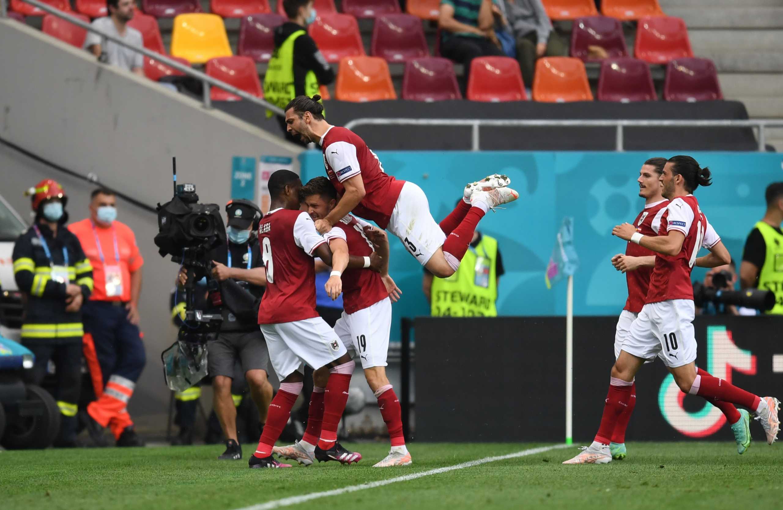 Soccer Football - Euro 2020 - Group C - Ukraine v Austria - National Arena Bucharest, Bucharest, Romania - June 21, 2021 Austria's Christoph Baumgartner celebrates scoring their first goal with teammates Pool via REUTERS