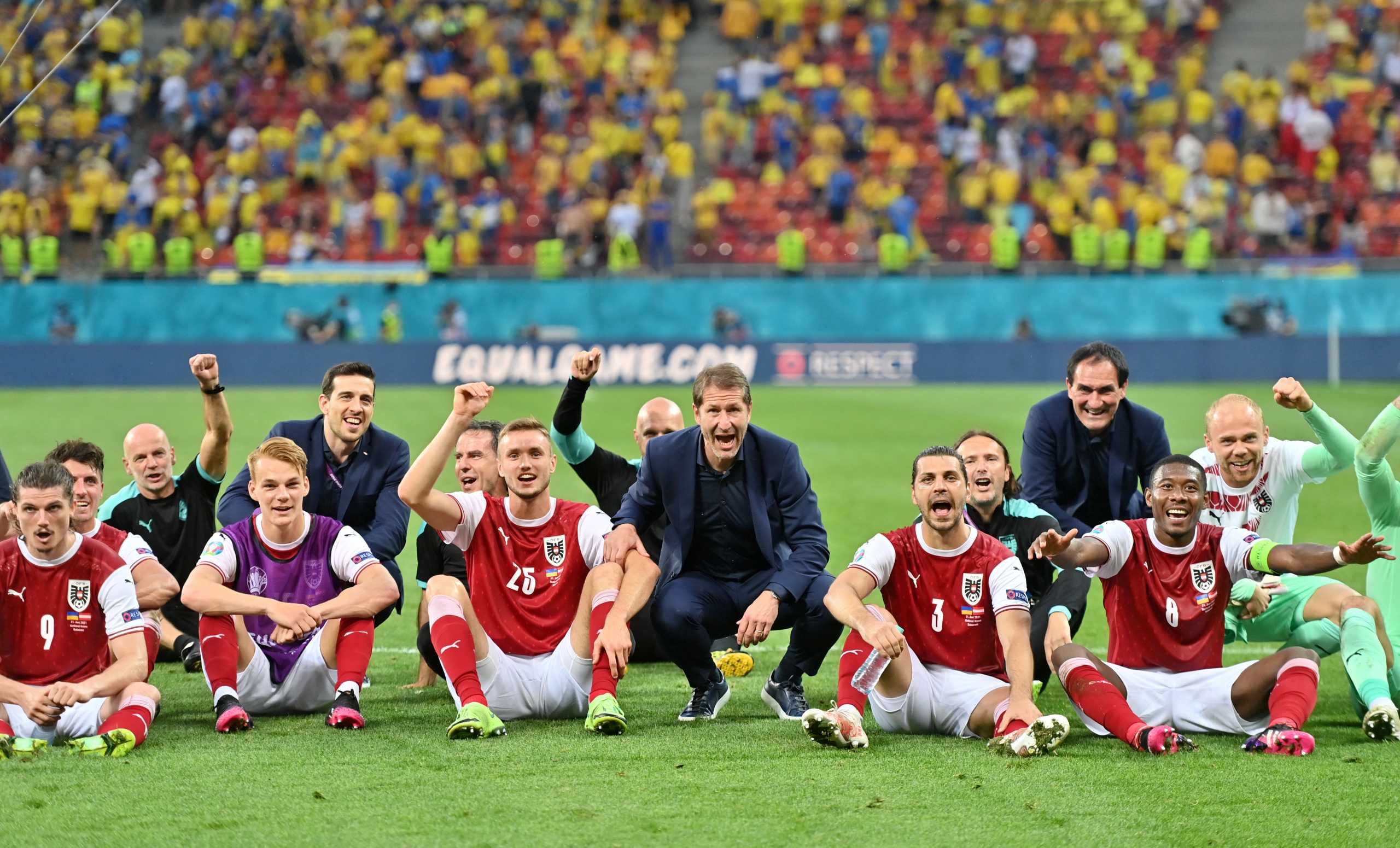 Soccer Football - Euro 2020 - Group C - Ukraine v Austria - National Arena Bucharest, Bucharest, Romania - June 21, 2021 Austria coach Franco Foda celebrates with players after the match Pool via REUTERS
