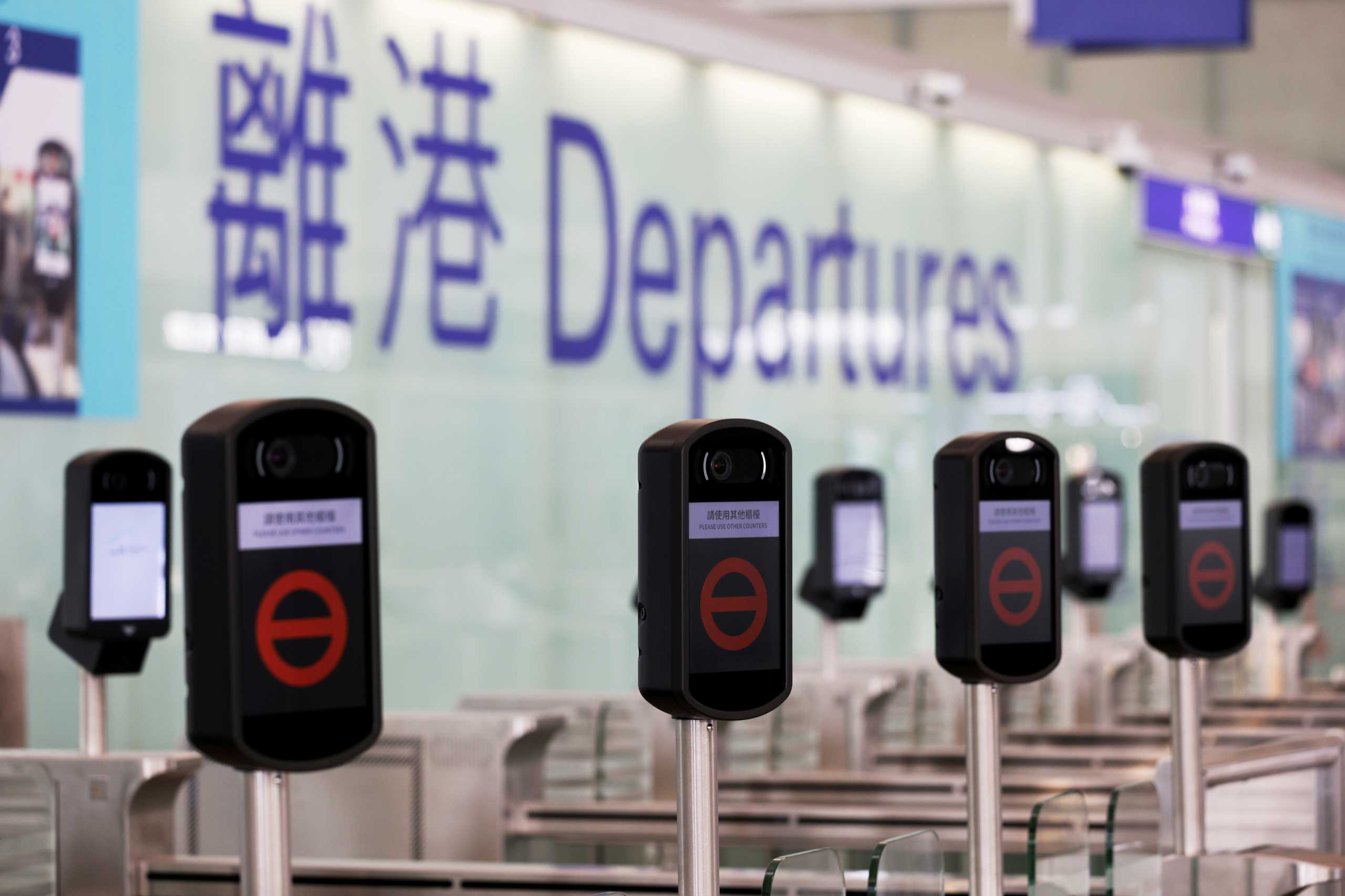 FILE PHOTO: Closed counters are seen at the departures hall of Hong Kong International Airport, following the coronavirus disease (COVID-19) outbreak, in Hong Kong, China February 2, 2021. REUTERS