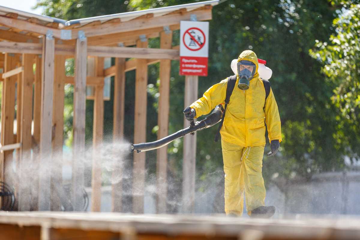A specialist wearing personal protective equipment (PPE) sprays disinfectant while sanitizing the Rizhsky Railway Station, one of the measures to curb the spread of the coronavirus disease (COVID-19), in Moscow, Russia June 17, 2021. Moscow Division of Russian Emergencies Ministry