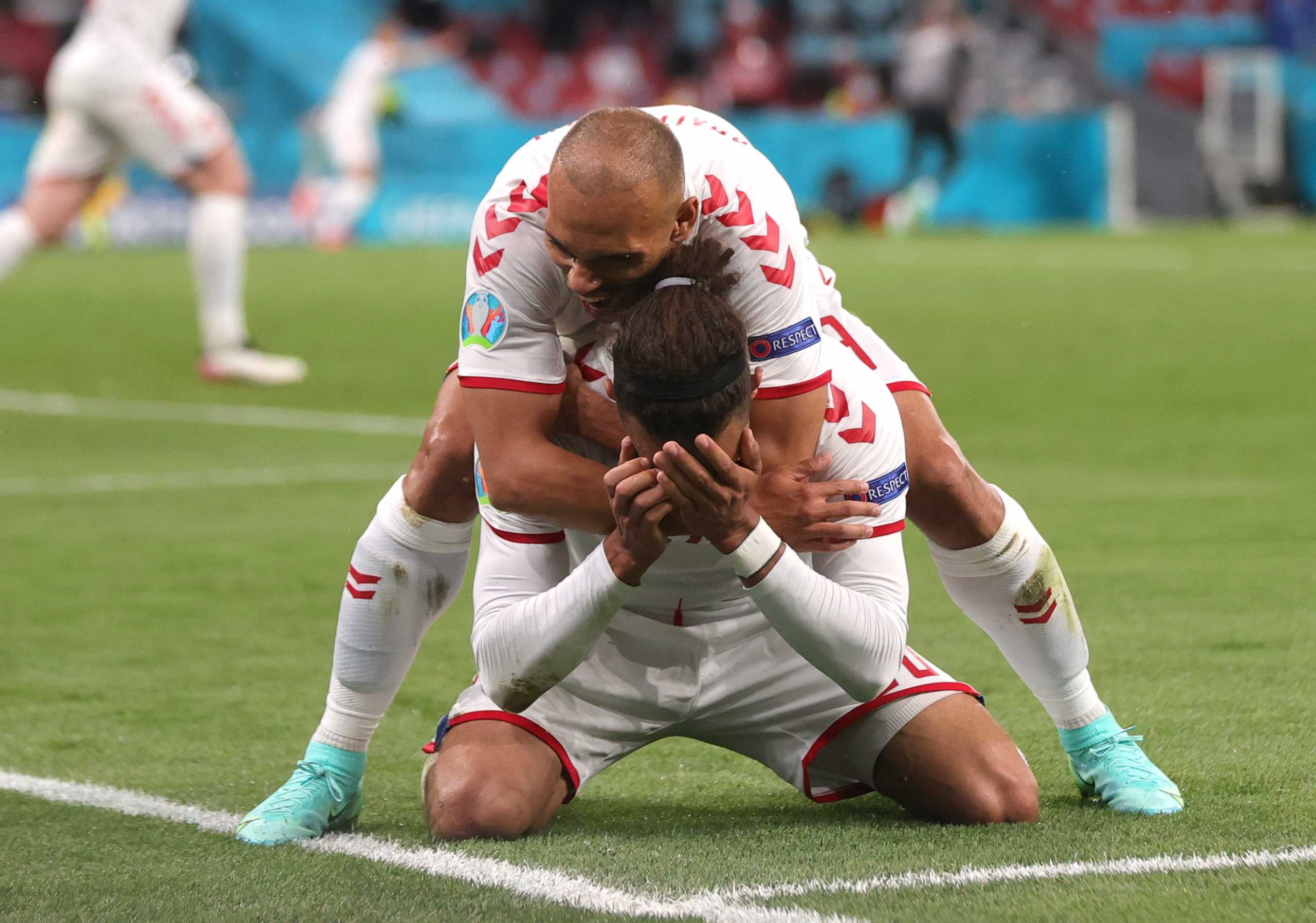 Soccer Football - Euro 2020 - Group B - Russia v Denmark - Parken Stadium, Copenhagen, Denmark - June 21, 2021  Denmark's Yussuf Poulsen celebrates scoring their second goal with teammate Martin Braithwaite  Pool via REUTERS