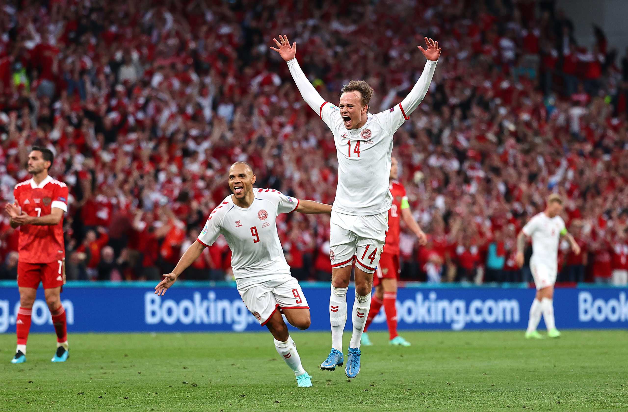 Soccer Football - Euro 2020 - Group B - Russia v Denmark - Parken Stadium, Copenhagen, Denmark - June 21, 2021 Denmark's Mikkel Damsgaard celebrates scoring their first goal with Martin Braithwaite Pool via REUTERS