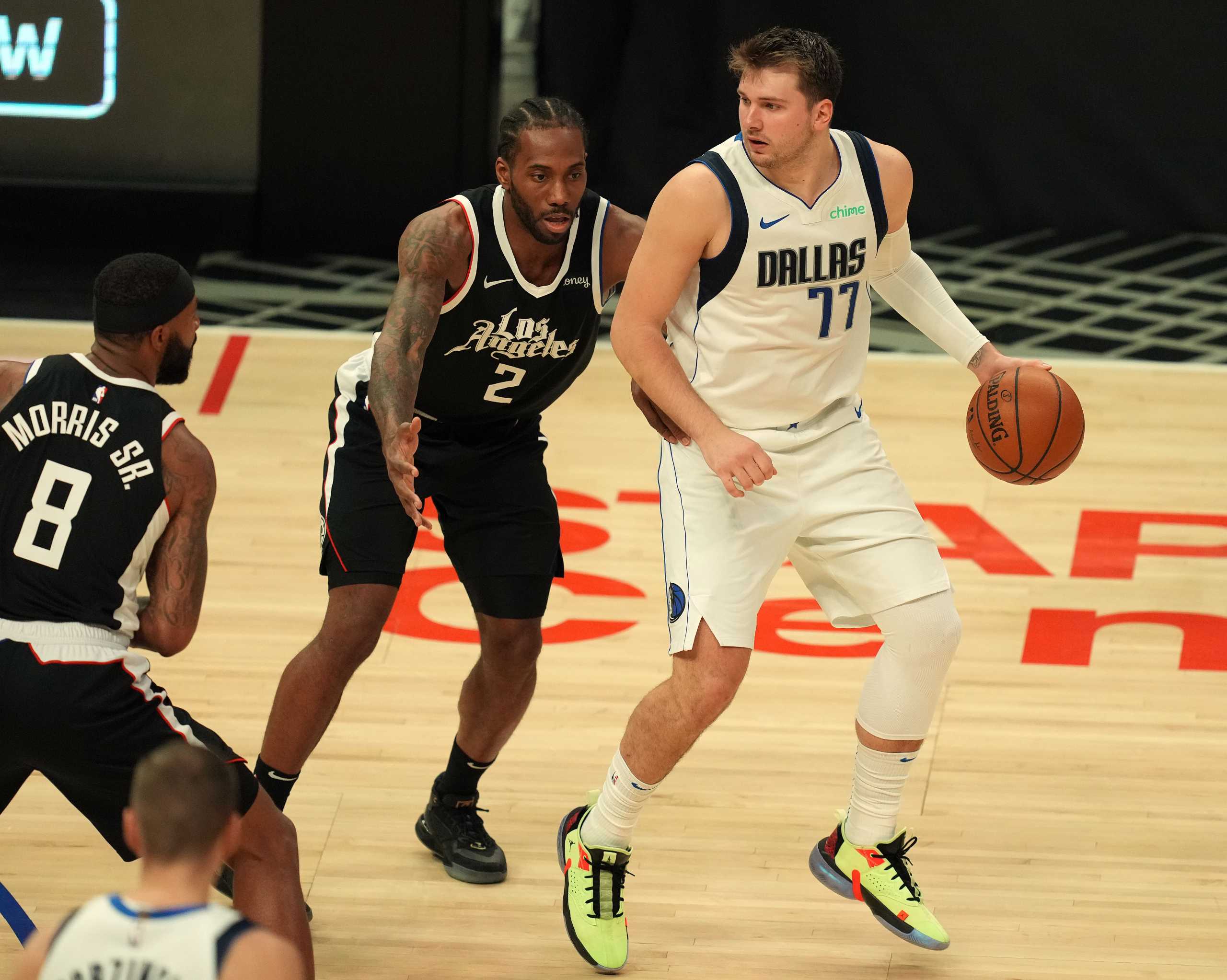 Jun 6, 2021; Los Angeles, California, USA; Dallas Mavericks guard Luka Doncic (77) controls the ball against Los Angeles Clippers forward Kawhi Leonard (2) during the second half in game seven of the first round of the 2021 NBA Playoffs. at Staples Center. Mandatory Credit: Kirby Lee-USA TODAY Sports