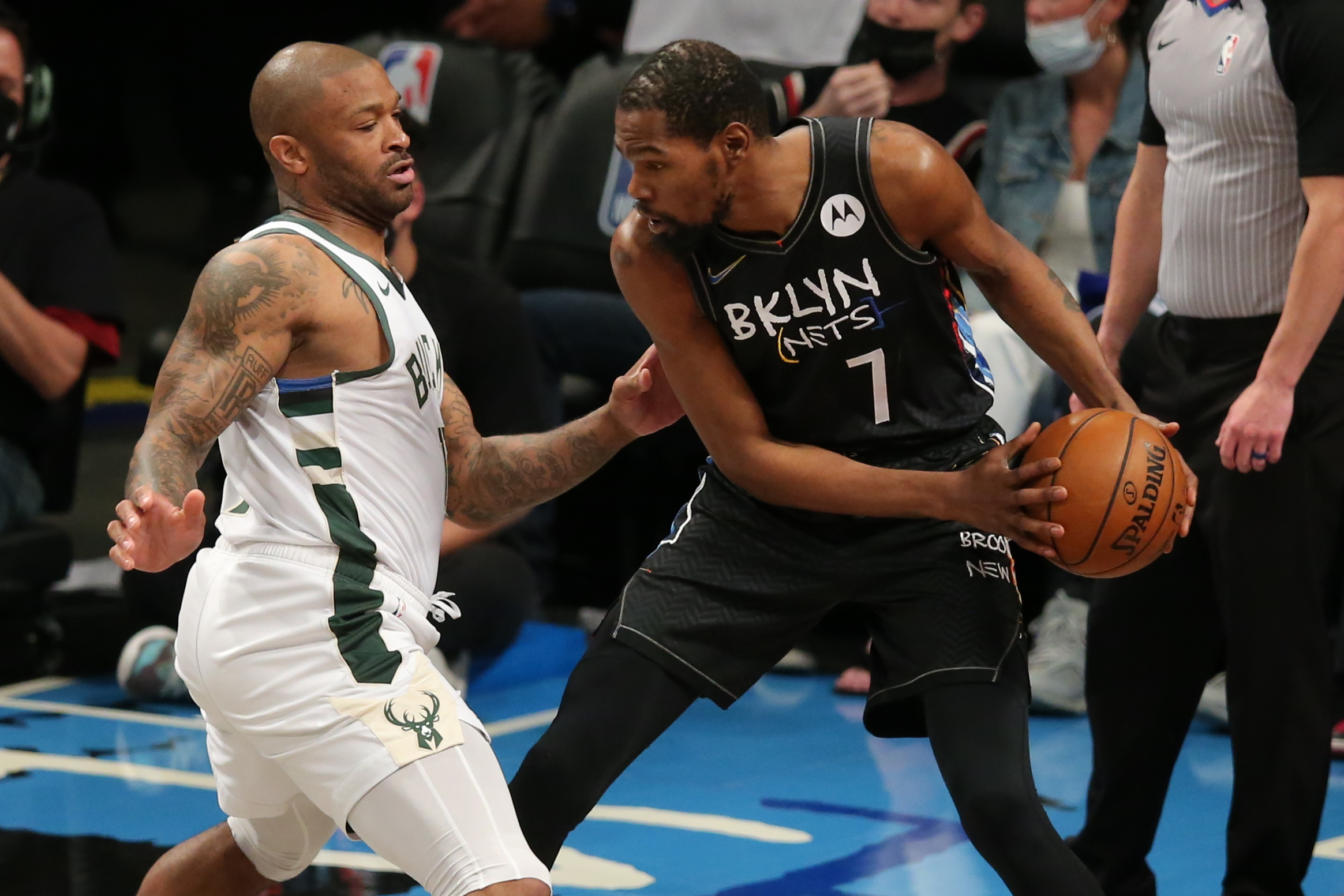 Jun 15, 2021; Brooklyn, New York, USA; Brooklyn Nets power forward Kevin Durant (7) controls the ball against Milwaukee Bucks power forward P.J. Tucker (17) during the first quarter of game five of the second round of the 2021 NBA Playoffs at Barclays Center. Mandatory Credit: Brad Penner-USA TODAY Sports