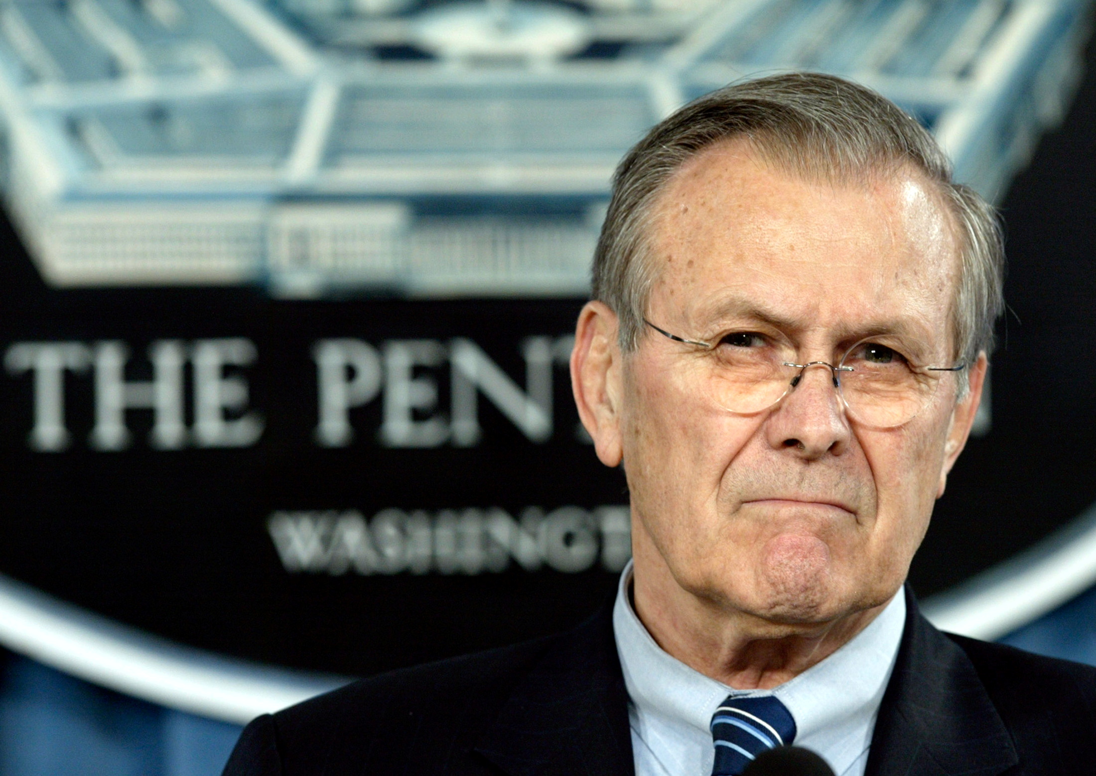 FILE PHOTO: U.S. Secretary of Defense Donald Rumsfeld pauses during his joint news conference with General Peter Pace, Vice Chairman of the Joint Chiefs of Staff, at the Pentagon in Washington, March 29, 2005. REUTERS