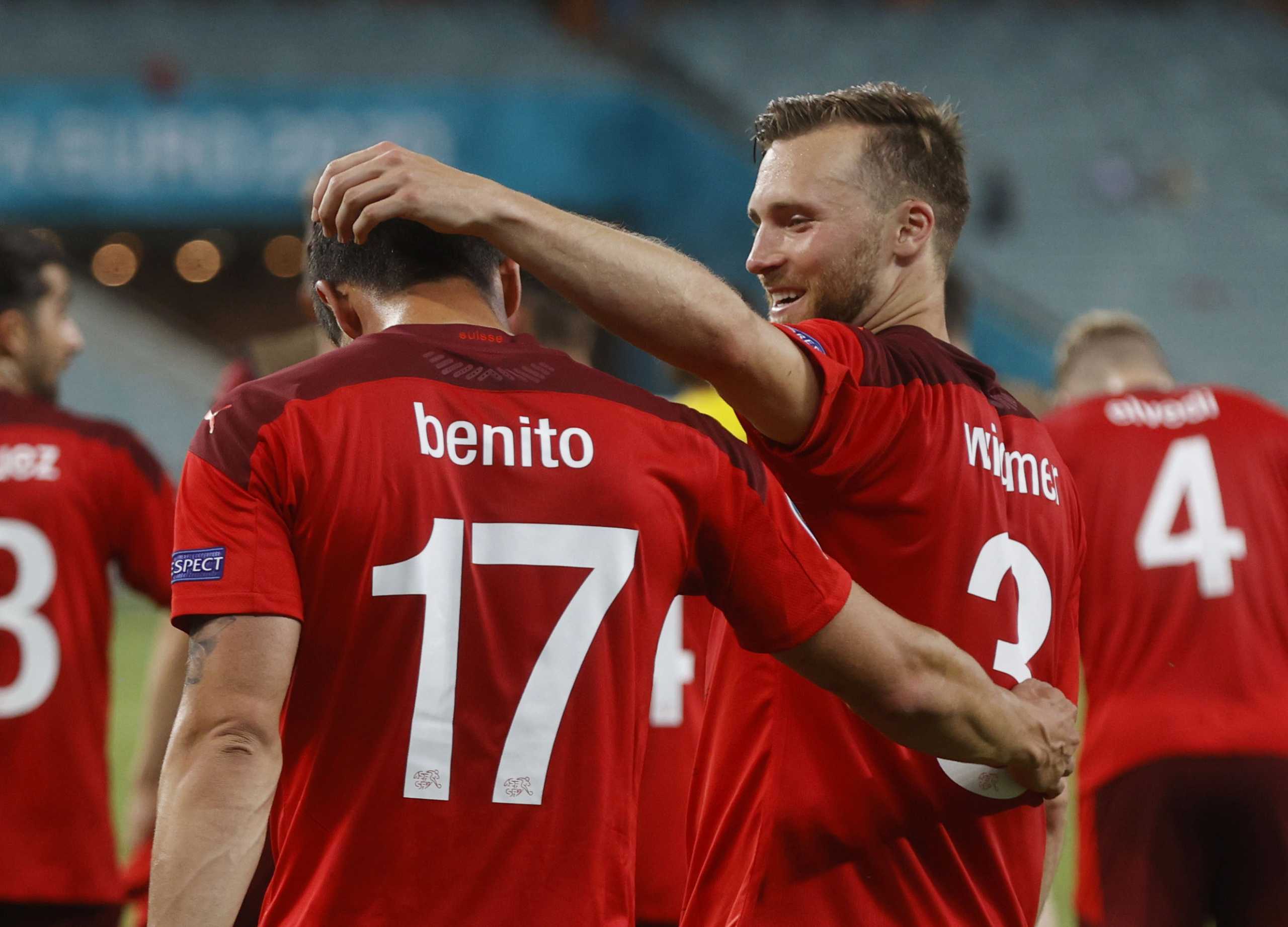 Soccer Football - Euro 2020 - Group A - Switzerland v Turkey - Baku Olympic Stadium, Baku, Azerbaijan - June 20, 2021 Switzerland's Loris Benito and Silvan Widmer after the match Pool via REUTERS