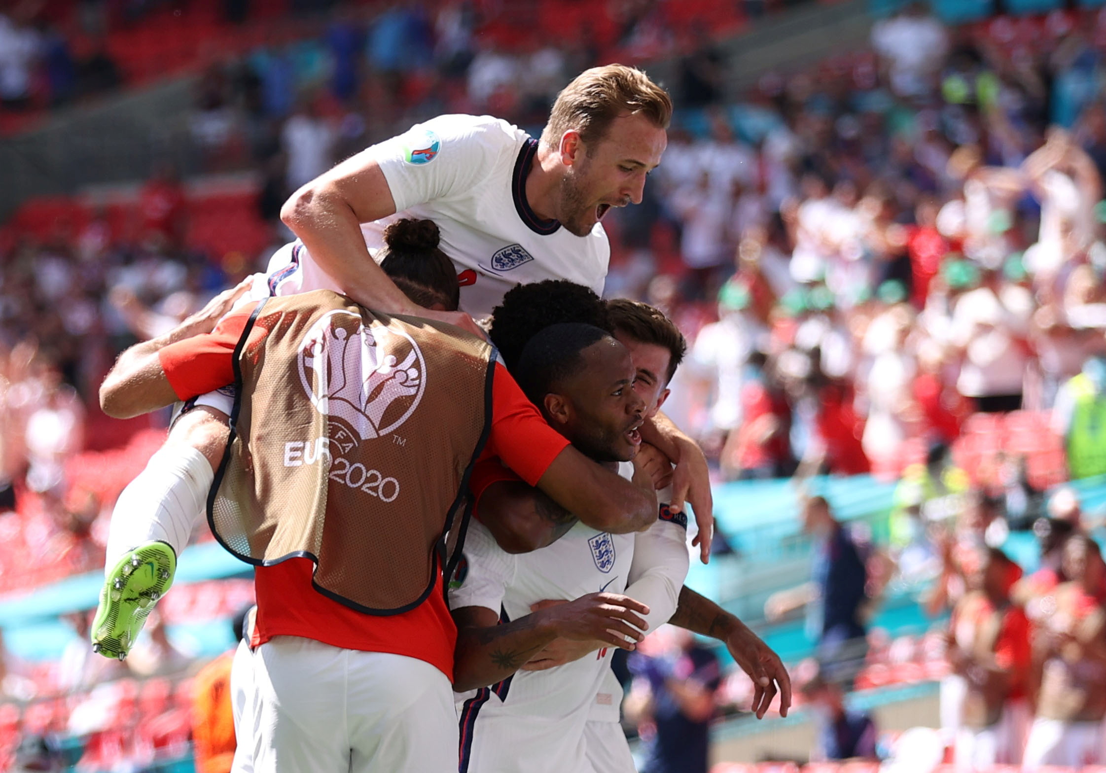 Soccer Football - Euro 2020 - Group D - England v Croatia - Wembley Stadium, London, Britain - June 13, 2021 England's Raheem Sterling celebrates scoring their first goal with teammates Pool via REUTERS