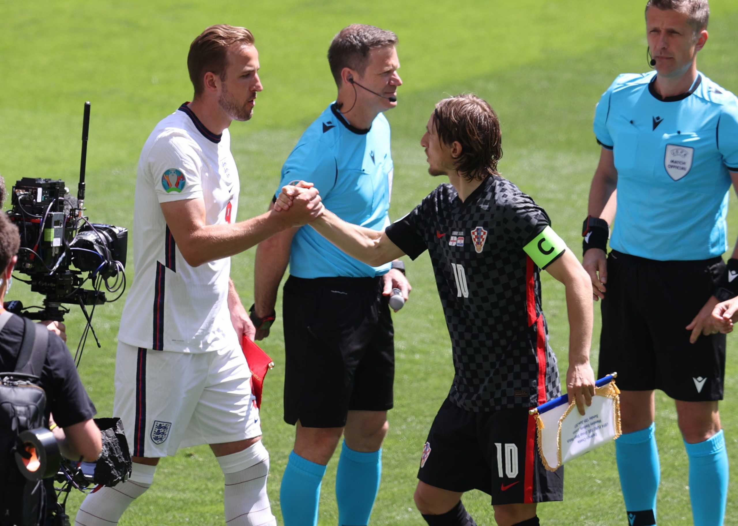 Soccer Football - Euro 2020 - Group D - England v Croatia - Wembley Stadium, London, Britain - June 13, 2021 England's Harry Kane with Croatia's Luka Modric before the match Pool via REUTERS
