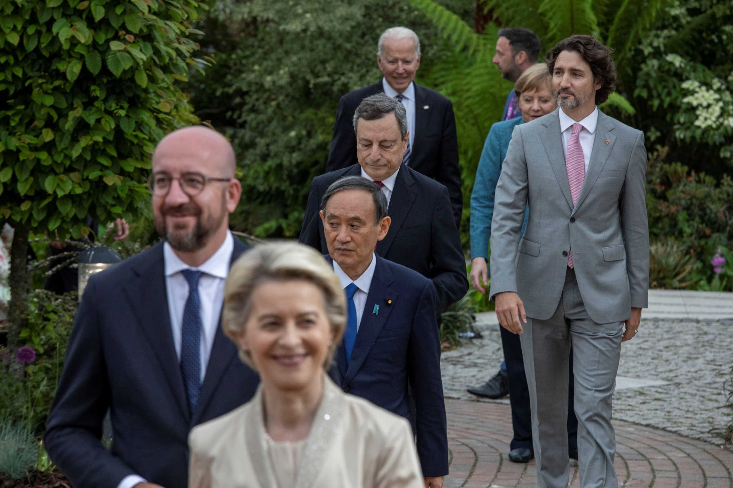 European Commission President Ursula von der Leyen, European Council President Charles Michel, Japan's Prime Minister Yoshihide Suga, Italy's Prime Minister Mario Draghi, Canada's Prime Minister Justin Trudeau, U.S. President Joe Biden and German Chancellor Angela Merkel attend a drinks reception on the sidelines of the G7 summit, at the Eden Project in Cornwall, Britain June 11, 2021. Jack Hill