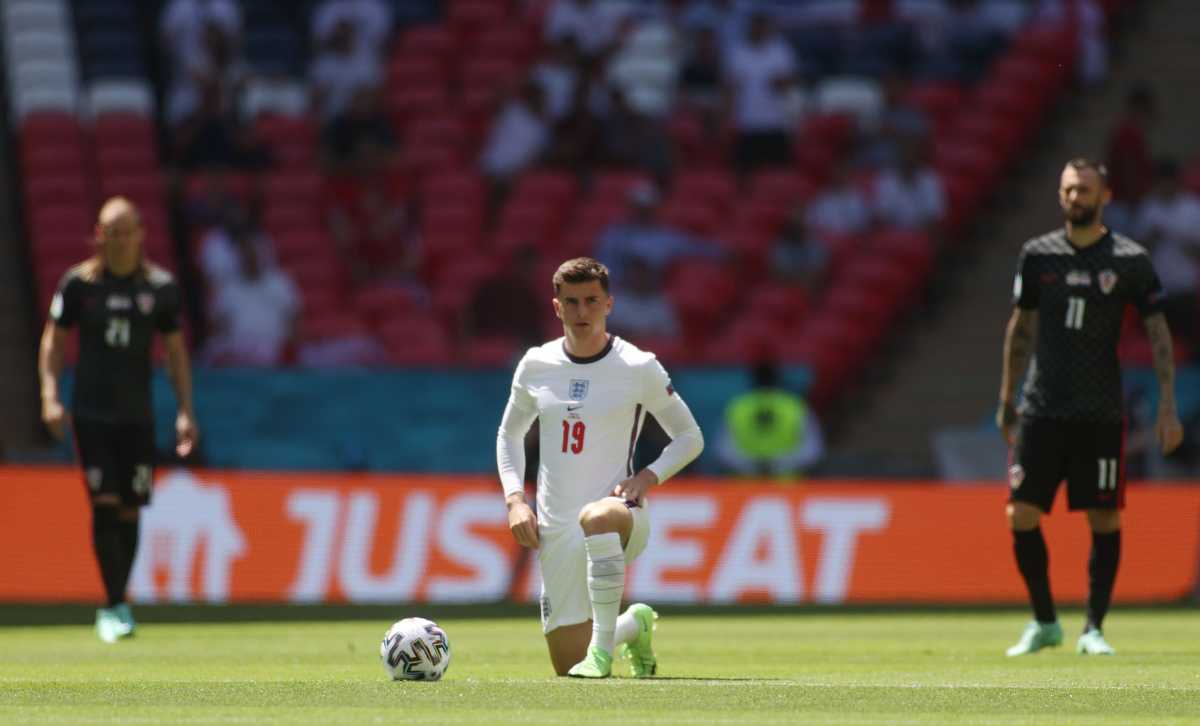 Soccer Football - Euro 2020 - Group D - England v Croatia - Wembley Stadium, London, Britain - June 13, 2021 England's Mason Mount takes the knee before the match Pool via REUTERS