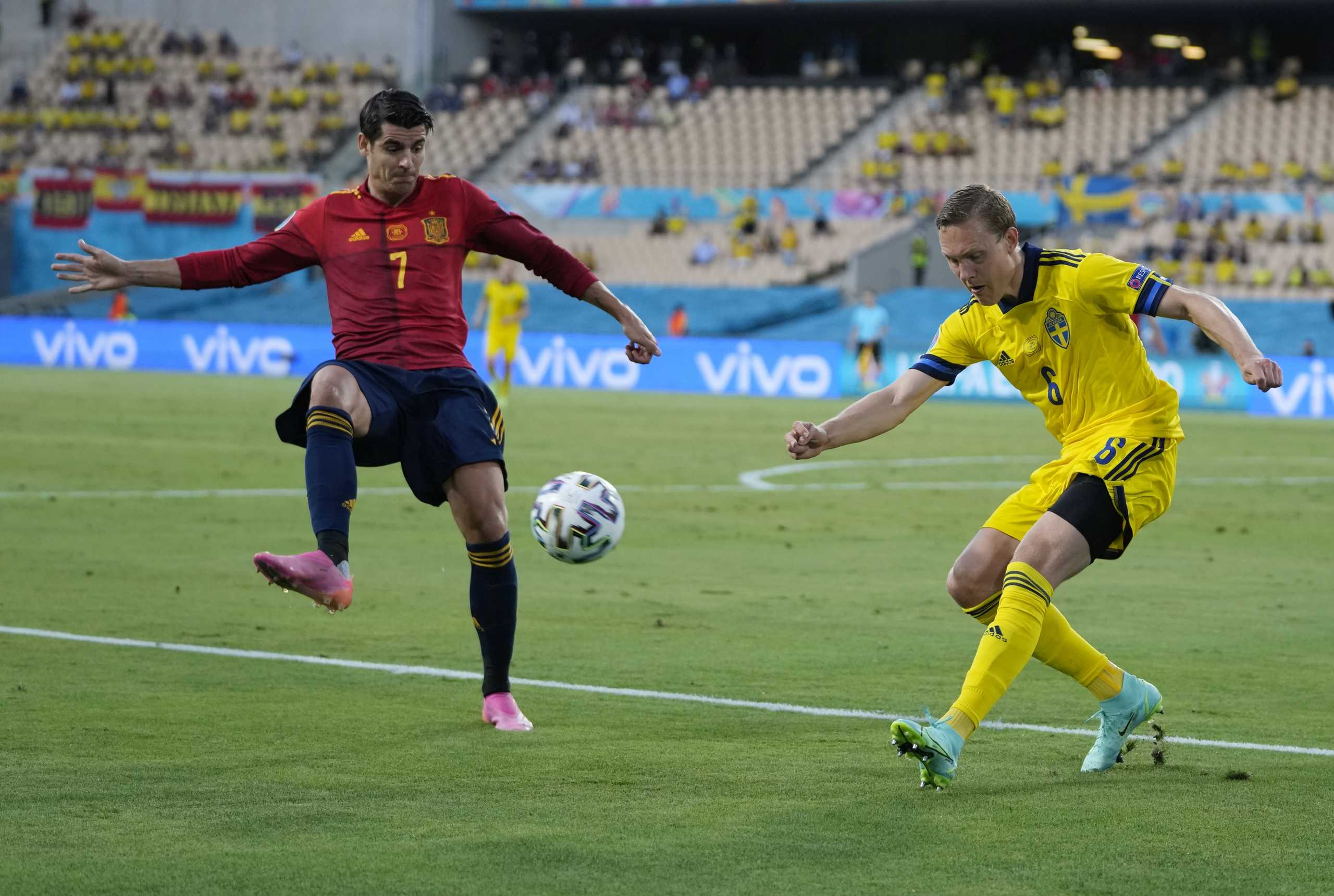 Soccer Football - Euro 2020 - Group E - Spain v Sweden - La Cartuja, Seville, Spain - June 14, 2021 Spain's Alvaro Morata in action with Sweden's Ludwig Augustinsson Pool via REUTERS