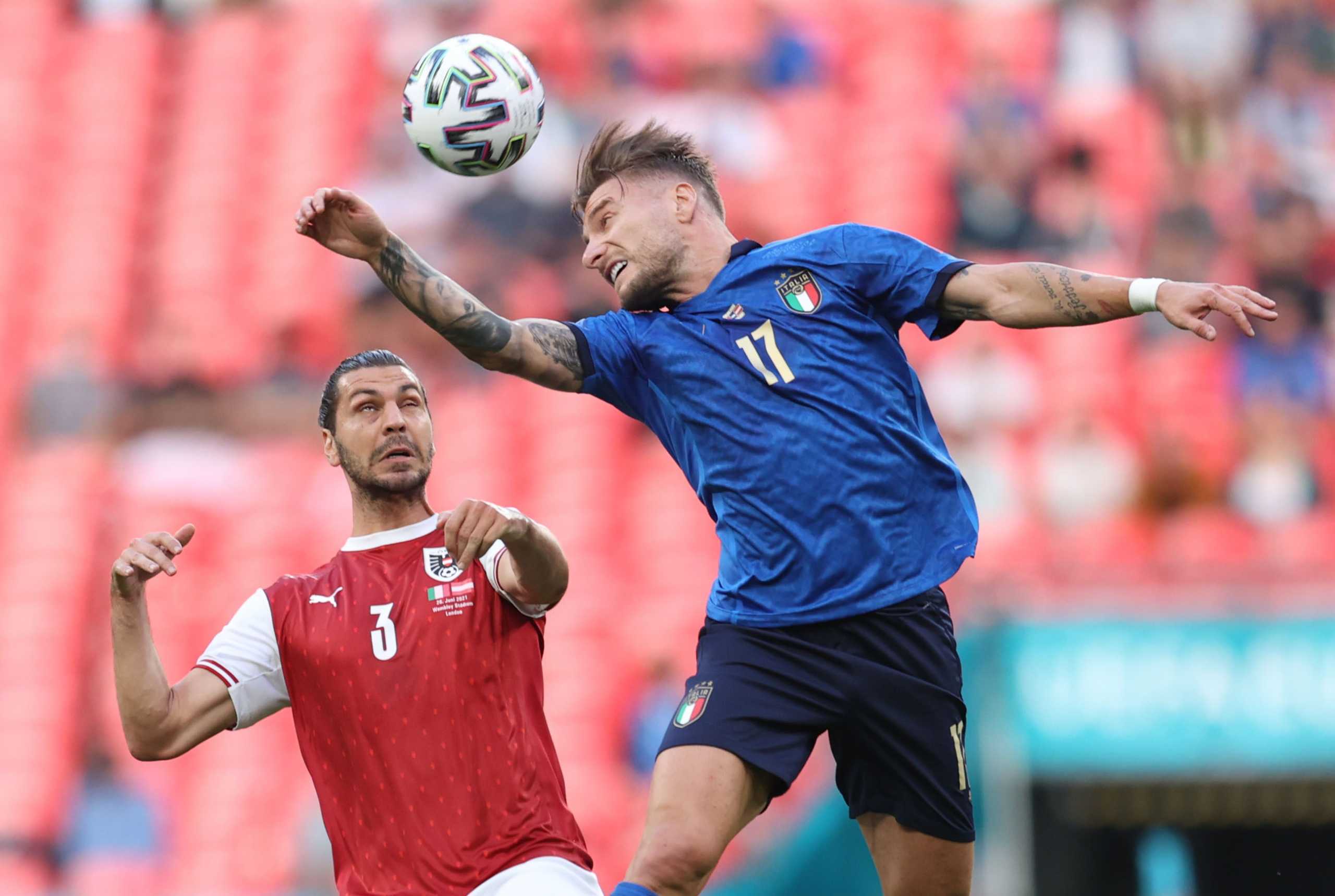 Soccer Football - Euro 2020 - Round of 16 - Italy v Austria - Wembley Stadium, London, Britain - June 26, 2021 Italy's Ciro Immobile in action with Austria's Aleksandar Dragovic Pool via REUTERS