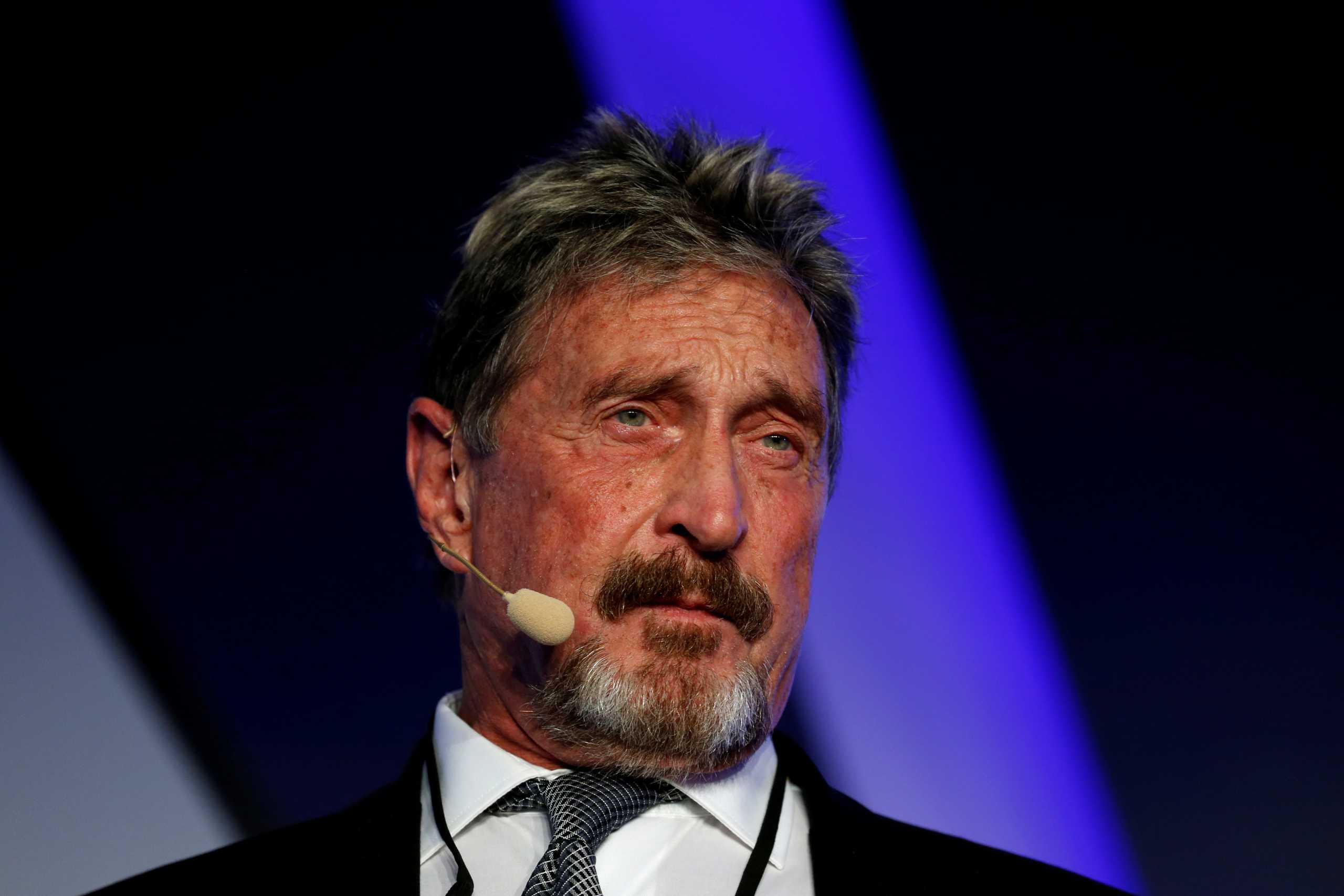 FILE PHOTO: John McAfee, co-founder of McAfee Crypto Team and CEO of Luxcore and founder of McAfee Antivirus, speaks at the Malta Blockchain Summit in St Julian's, Malta November 1, 2018. REUTERS