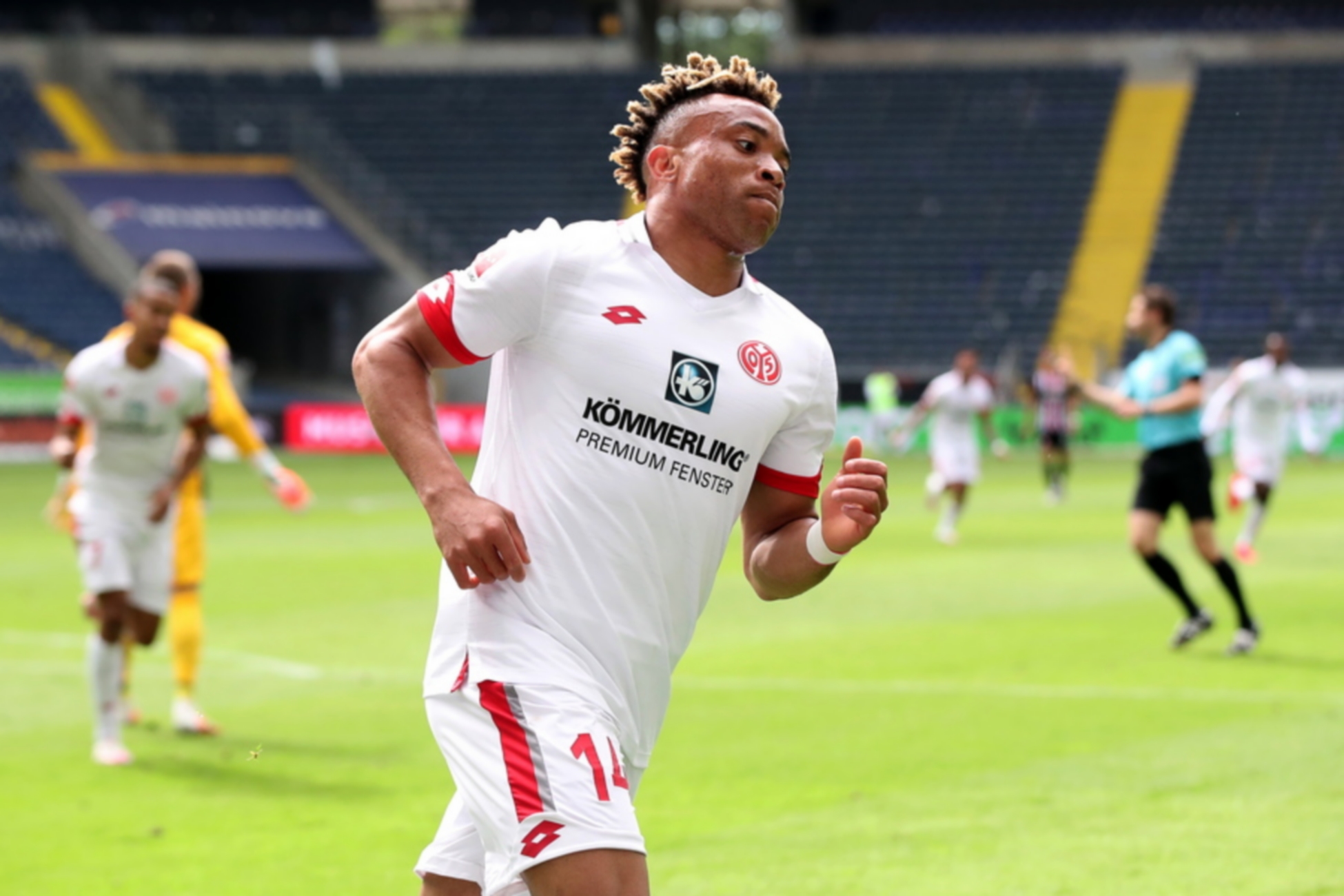 epa08469281 Pierre Kunde of Mainz reacts after scoring the 2-0 lead during the German Bundesliga soccer match between Eintracht Frankfurt and FSV Mainz 05 in Frankfurt Main, Germany, 06 June 2020.  EPA