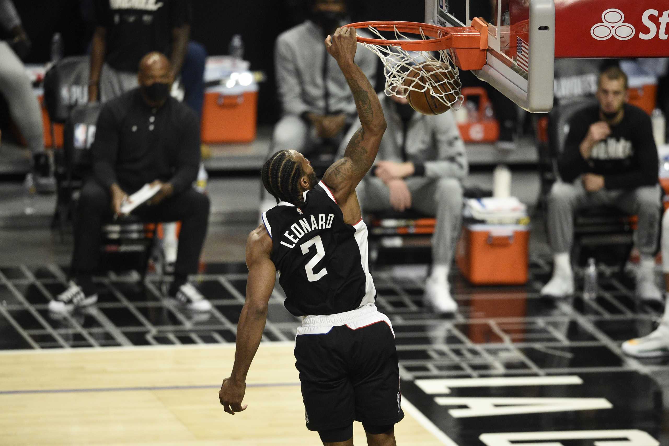 Jun 12, 2021; Los Angeles, California, USA; LA Clippers forward Kawhi Leonard (2) dunks the ball against the Utah Jazz in the second quarter during game three in the second round of the 2021 NBA Playoffs. at Staples Center. Mandatory Credit: Kelvin Kuo-USA TODAY Sports