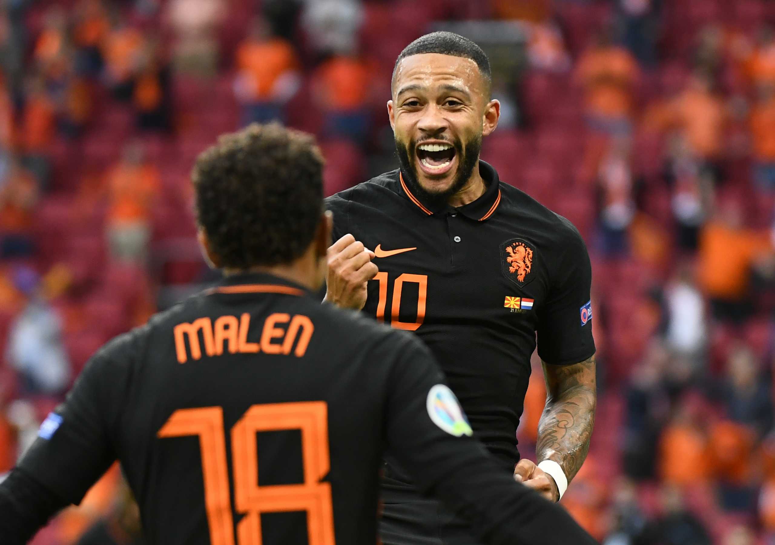 Soccer Football - Euro 2020 - Group C - North Macedonia v Netherlands - Johan Cruijff ArenA, Amsterdam, Netherlands - June 21, 2021 Netherlands' Memphis Depay and Donyell Malen celebrates scoring their first goal Pool via REUTERS