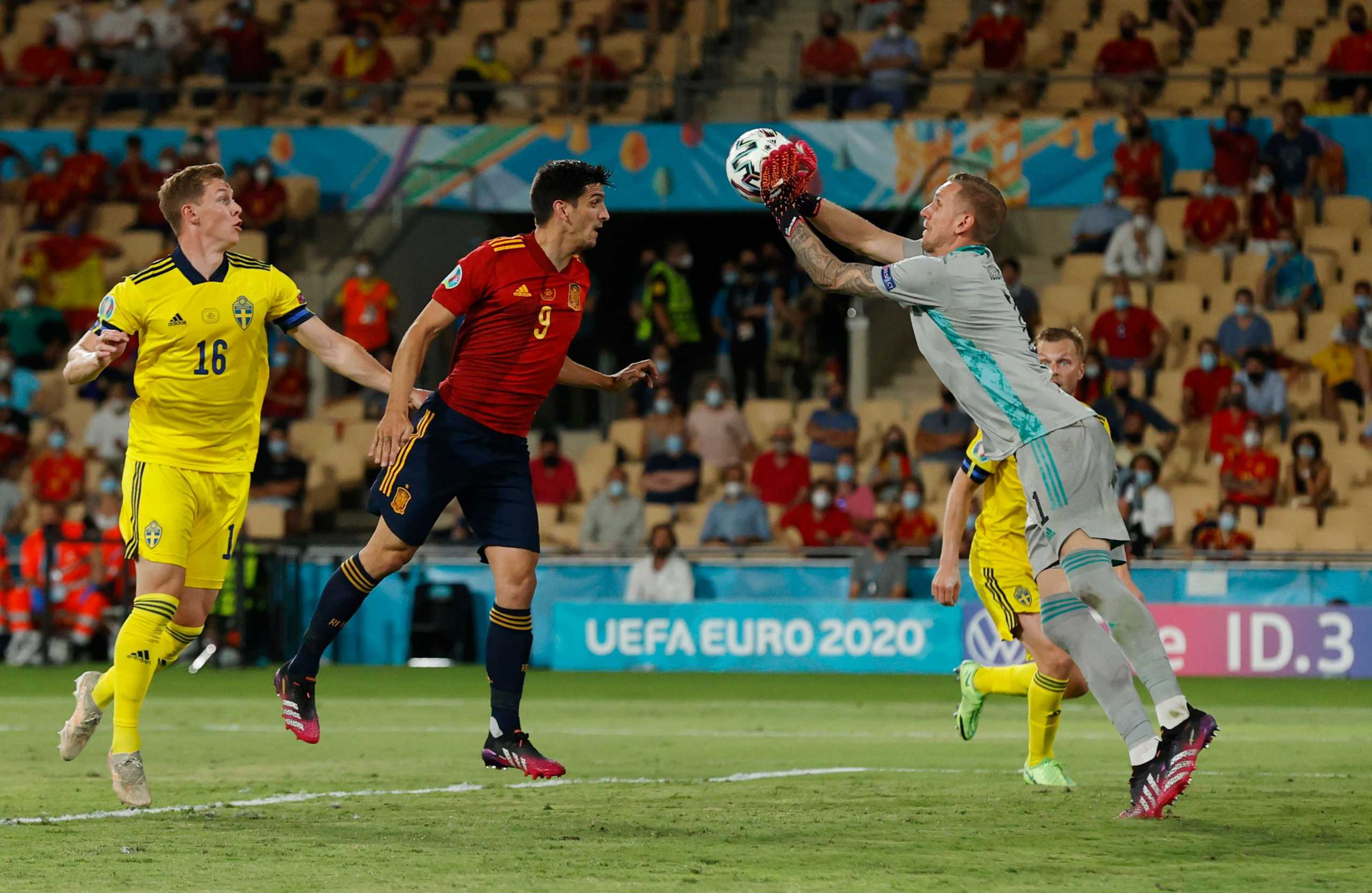Soccer Football - Euro 2020 - Group E - Spain v Sweden - La Cartuja, Seville, Spain - June 14, 2021 Sweden's Robin Olsen in action with Spain's Gerard Moreno Pool via REUTERS