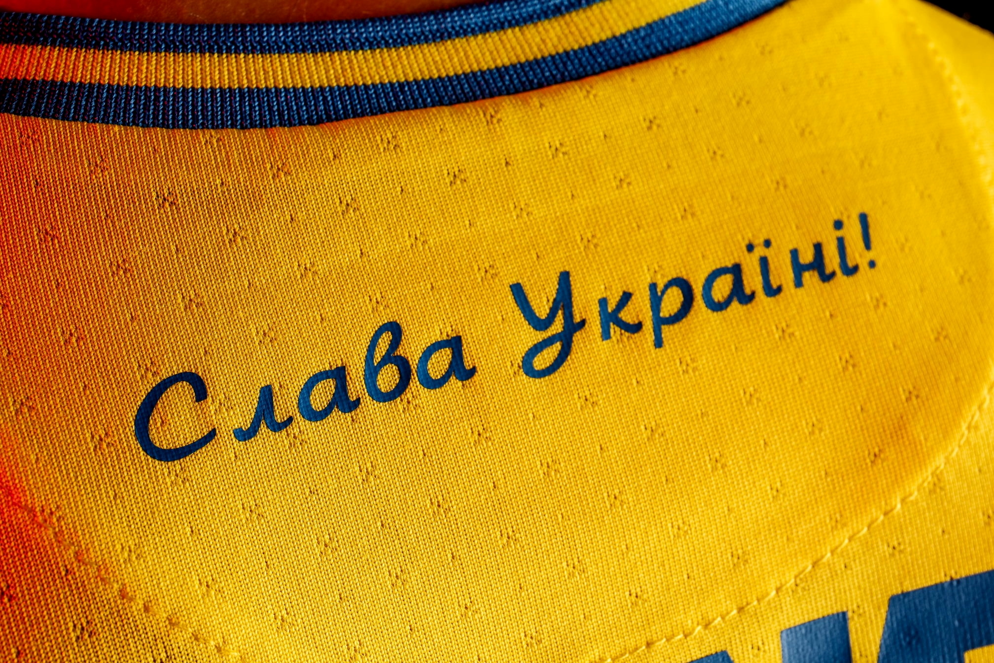 FILE PHOTO: A slogan reads "Glory to Ukraine!" on Ukraine's new national team shirt unveiled on June 6, ahead of Euro 2020, is seen in a picture published June 6, 2021 on the Facebook page of the head of the Ukrainian football association. Courtesy Facebook@ Andrii Pavelko via REUTERS ATTENTION EDITORS - THIS IMAGE HAS BEEN SUPPLIED BY A THIRD PARTY. MANDATORY CREDIT.