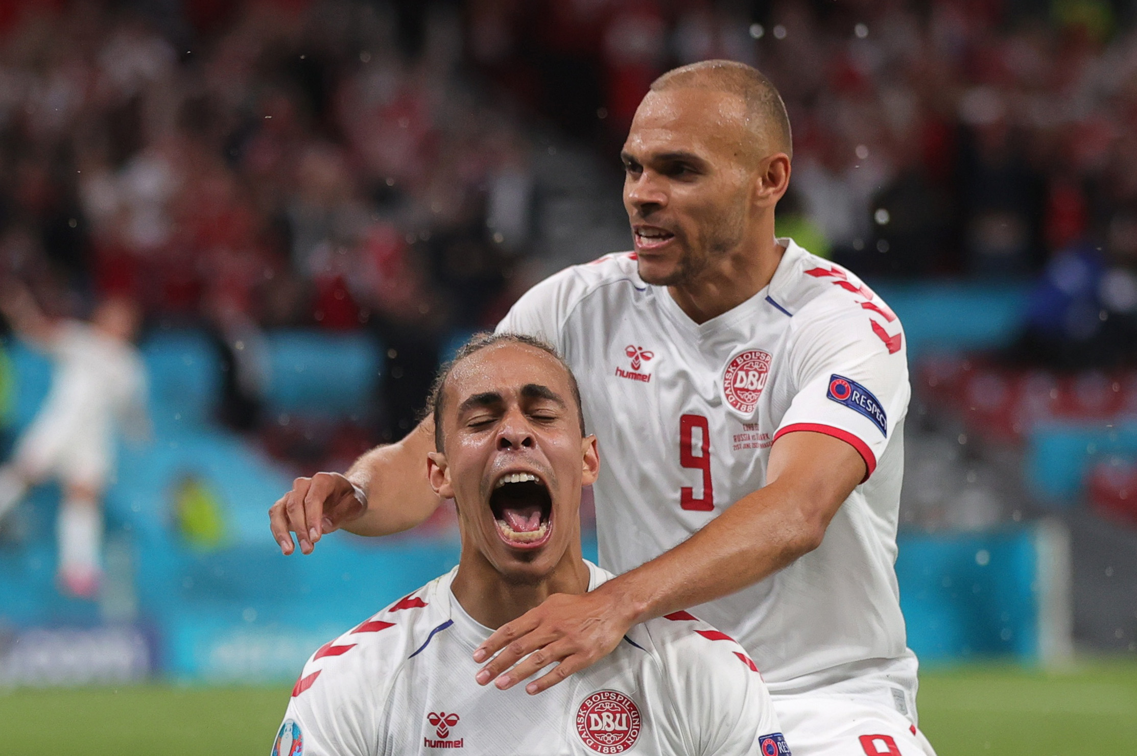 Soccer Football - Euro 2020 - Group B - Russia v Denmark - Parken Stadium, Copenhagen, Denmark - June 21, 2021  Denmark's Yussuf Poulsen celebrates scoring their second goal with teammate Martin Braithwaite Pool via REUTERS