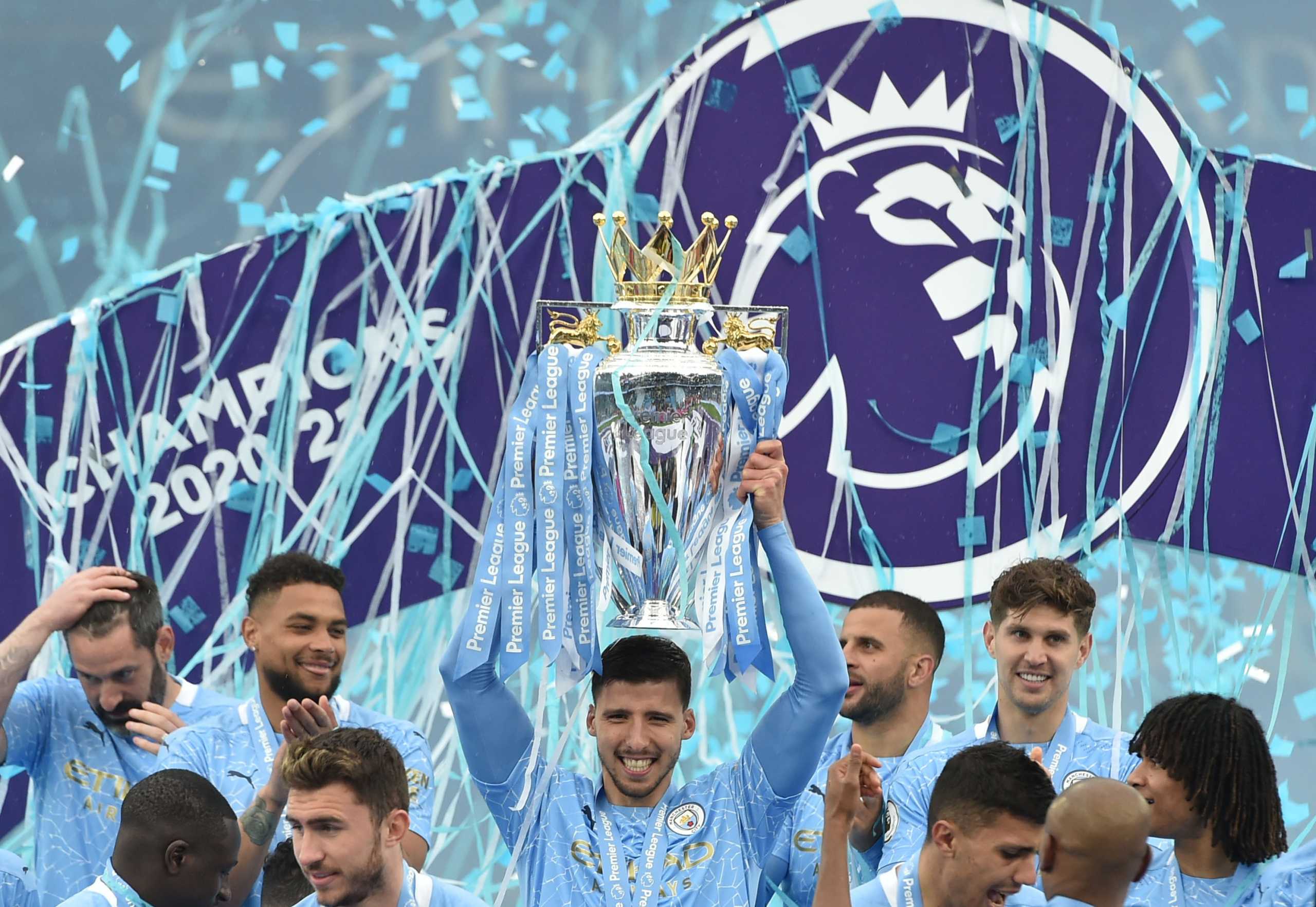 Soccer Football - Premier League - Manchester City v Everton - Etihad Stadium, Manchester, Britain - May 23, 2021 Manchester City's Ruben Dias celebrates with the trophy after winning the Premier League Pool via REUTERS