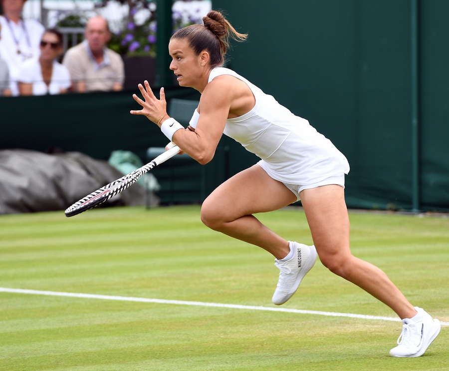 epa07691510 Maria Sakkari of Greece in action against Marie Bouzkova of the Czech Republic in their second round match during the Wimbledon Championships at the All England Lawn Tennis Club, in London, Britain, 03 July 2019. EPA